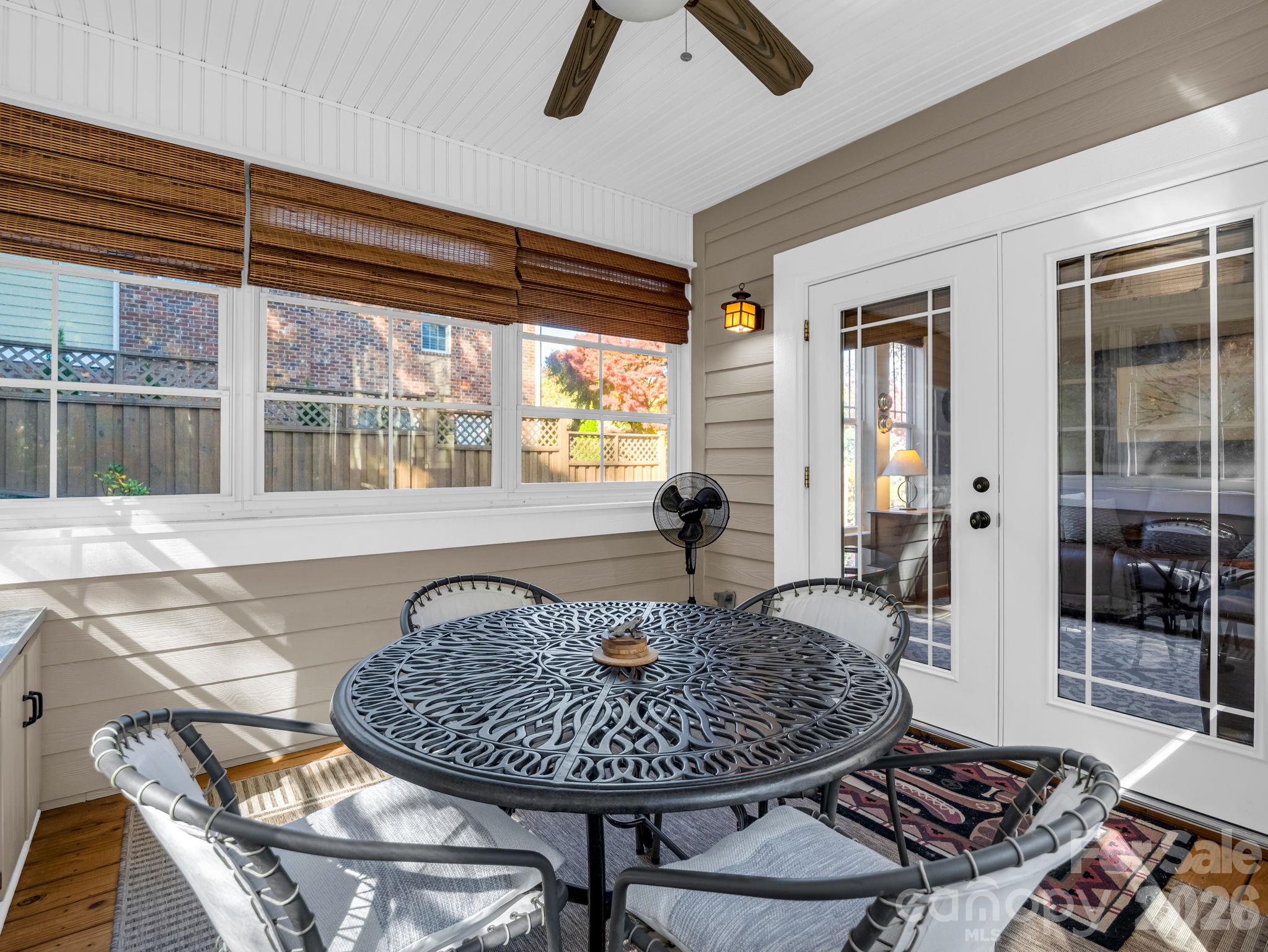 Sunroom with Eze Breeze windows, french doors - 376 Scarlet Tanager Court, Arden