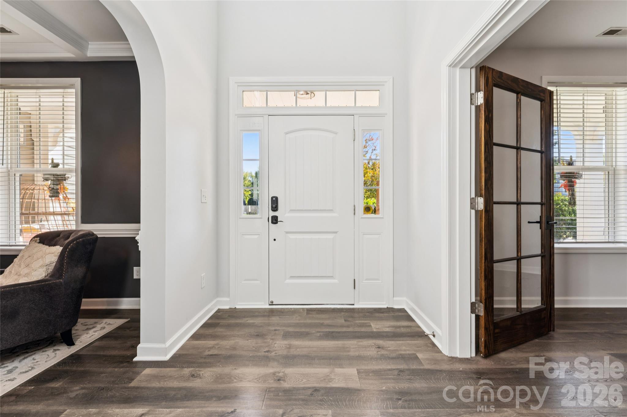 Welcoming foyer, neutral fresh paint throughout. Beautiful wood-grain flooring throughout main level. - 2014 Seefin Court, Indian Trail