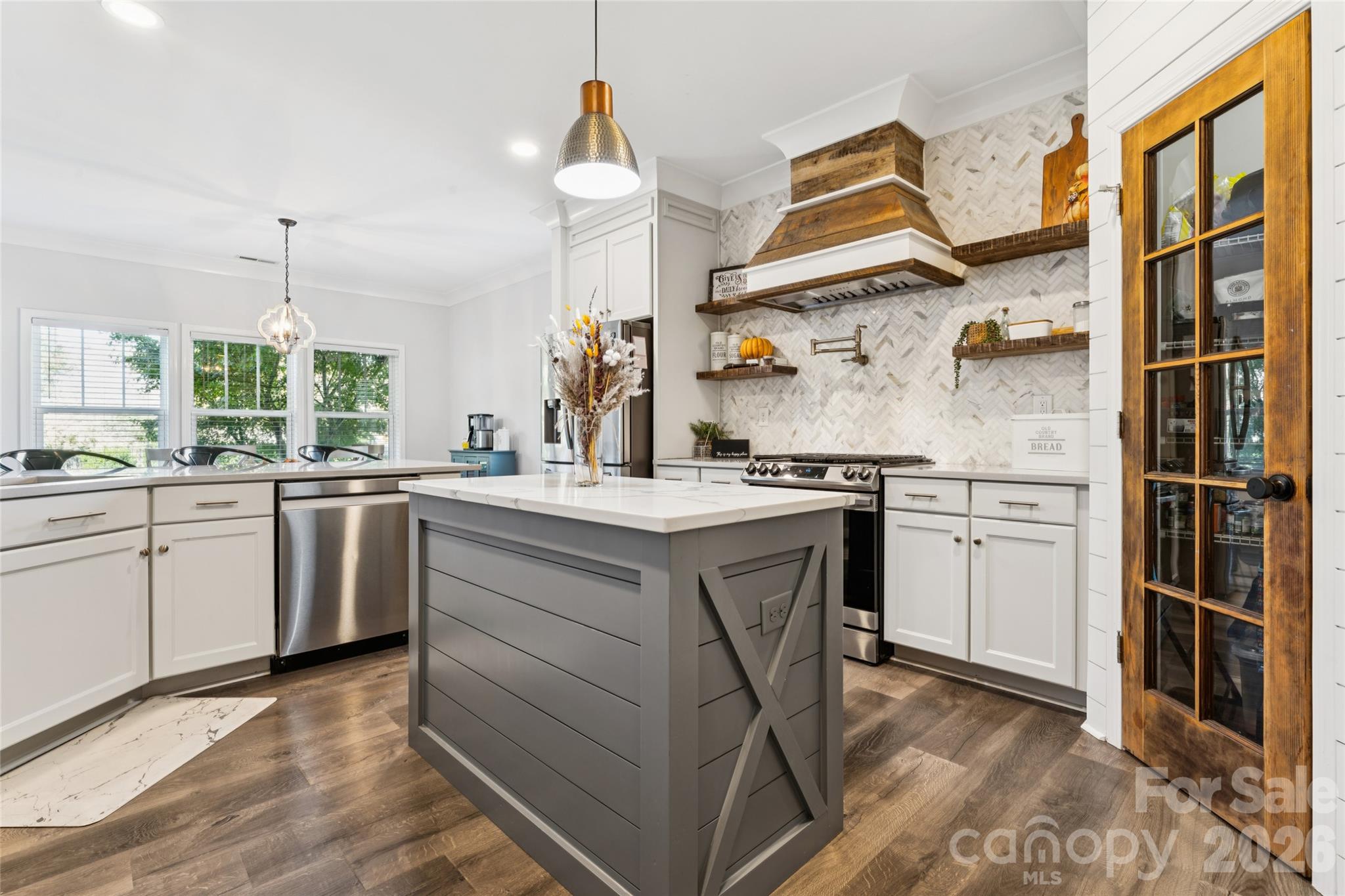 Walk-in pantry with custom wood glass paneled door. Amazing upgrades in this chefs dream kitchen. Can be yours by the holidays - 2014 Seefin Court, Indian Trail
