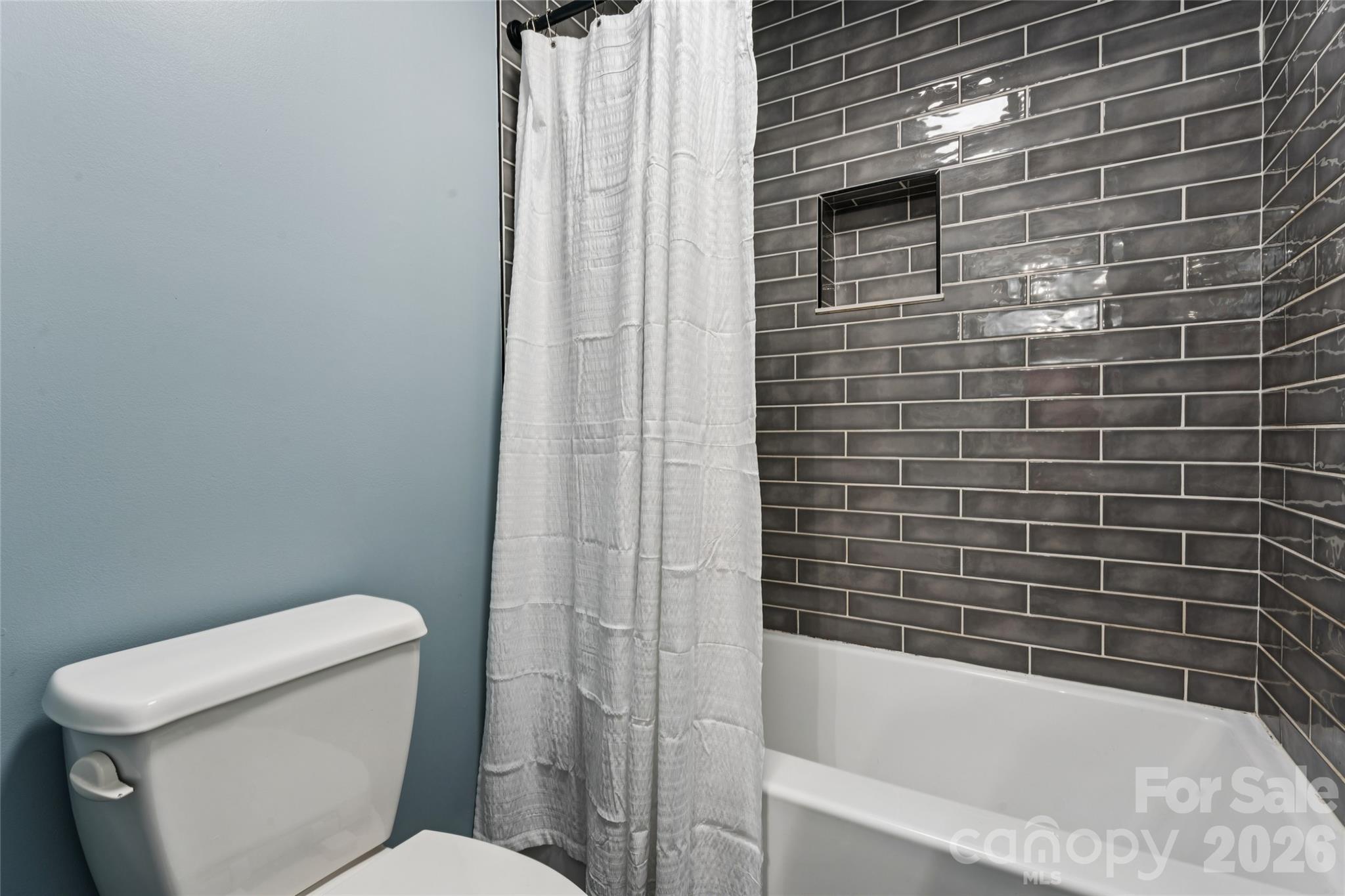 Shower/bath to jack/Jill bedroom. Beautiful tile to ceiling gives this space that luxurious element. - 2014 Seefin Court, Indian Trail