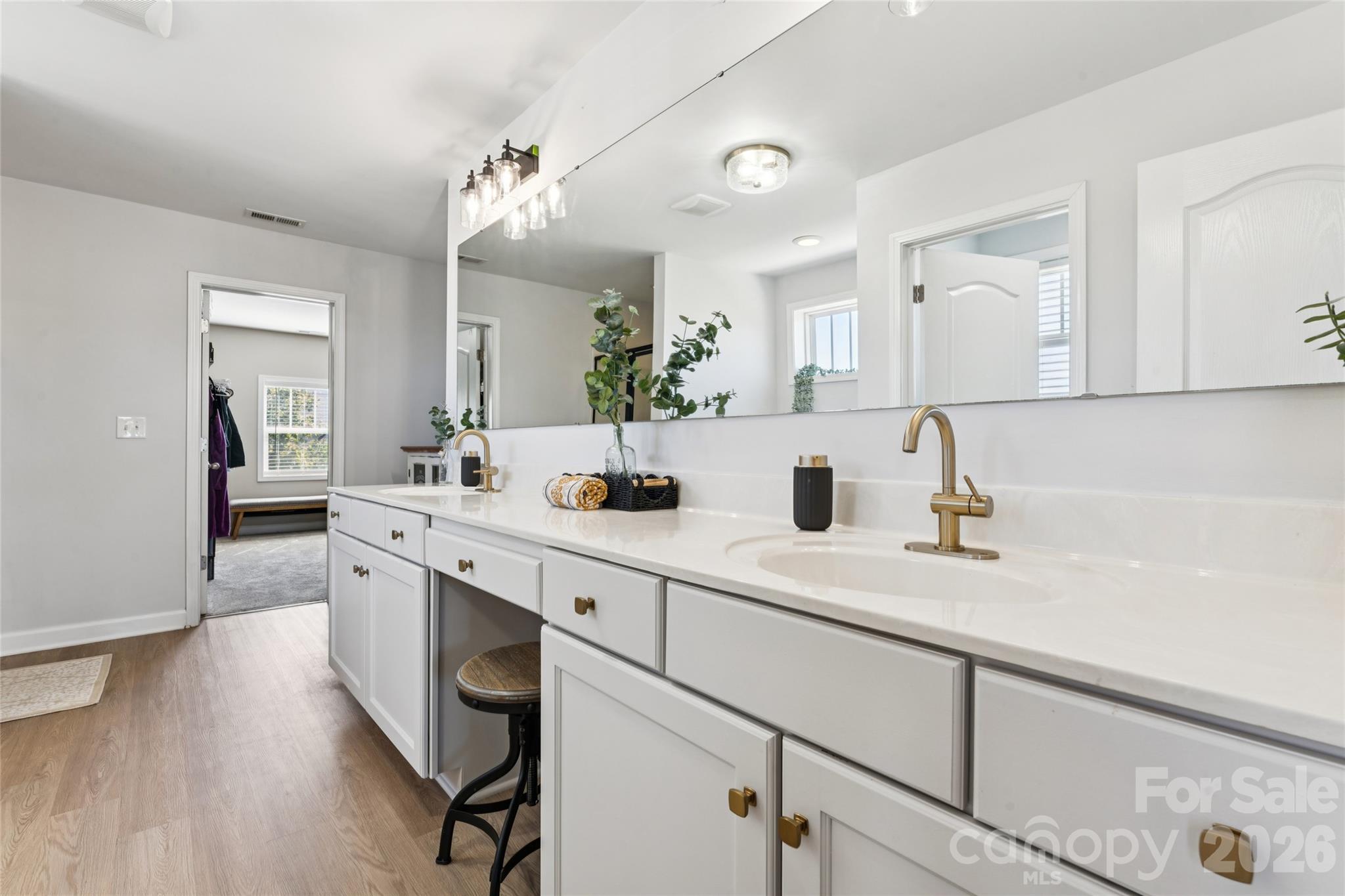 Large walk-in closet anchors this grand primary bath. - 2014 Seefin Court, Indian Trail