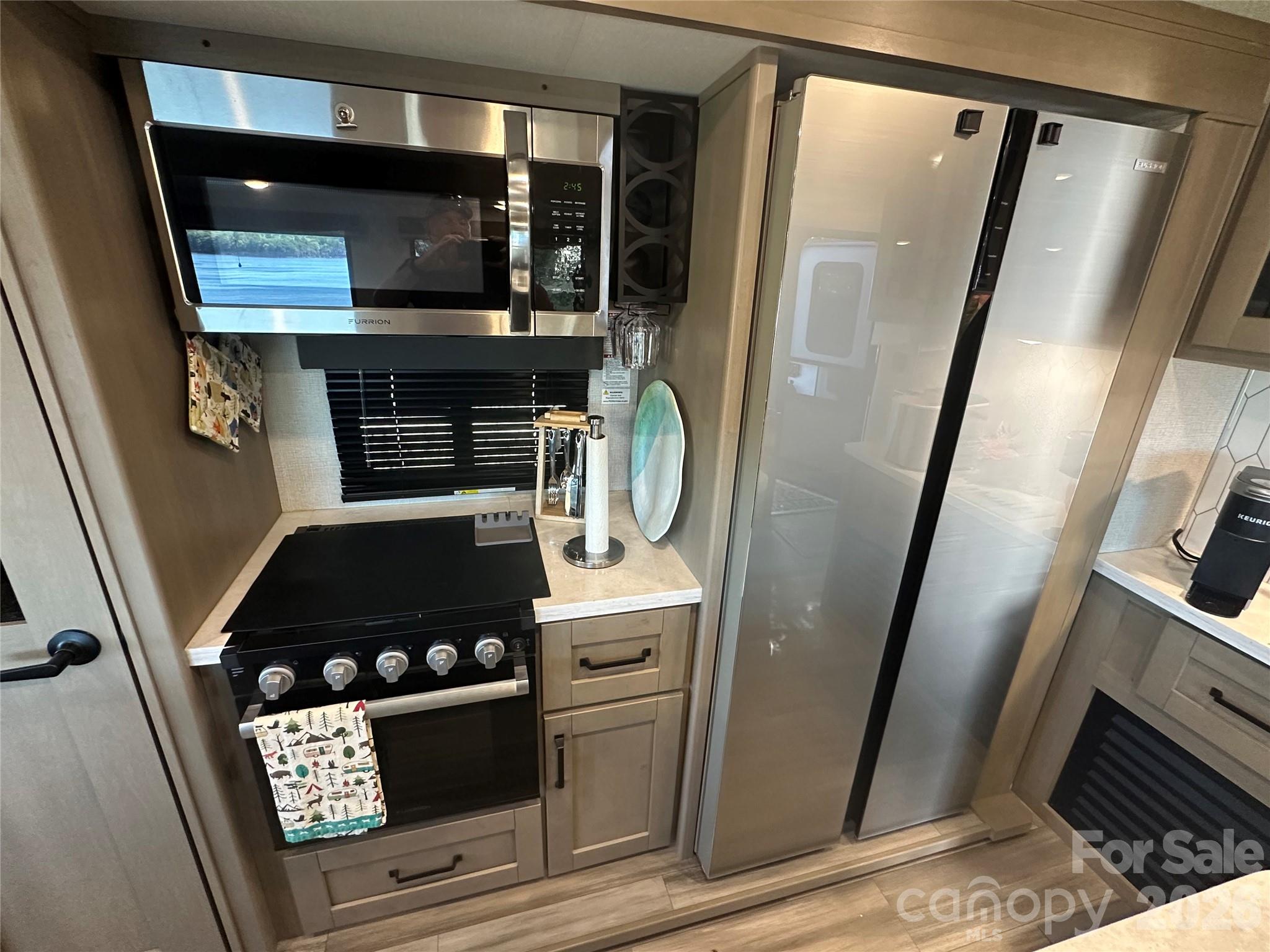 Full size microwave and propane stove, full size refrigerator - 103 Brit Lane, New London