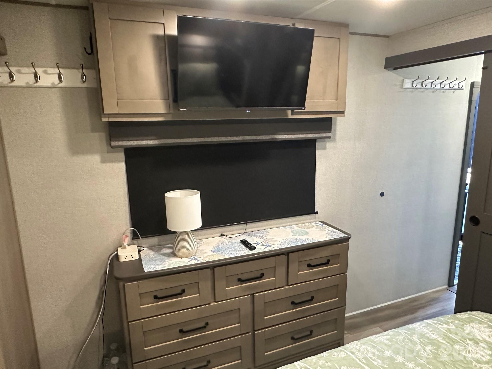 Built in Storage in the bedroom with Mounted TV - 103 Brit Lane, New London