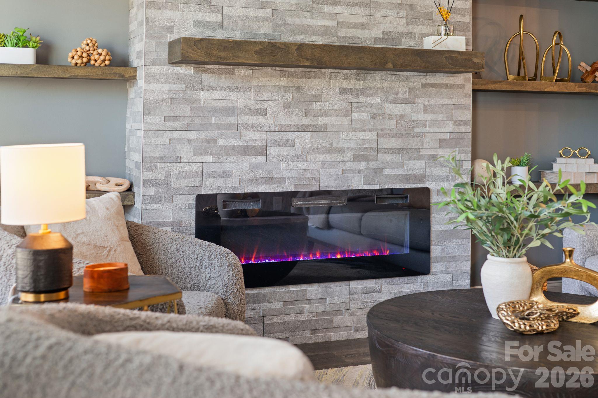 Elevated design with modern fireplace. - 42 Walnut Springs Drive, Asheville