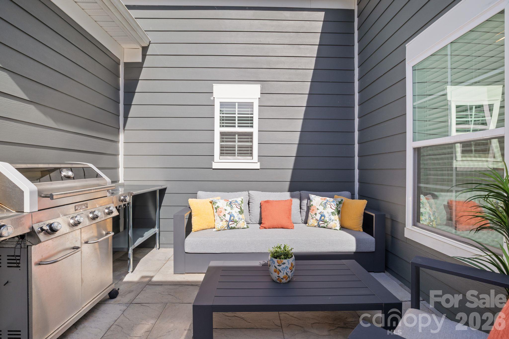 Cozy back patio to enjoy fall crisp mornings with your cup of coffee or your evening glass of wine. - 42 Walnut Springs Drive, Asheville