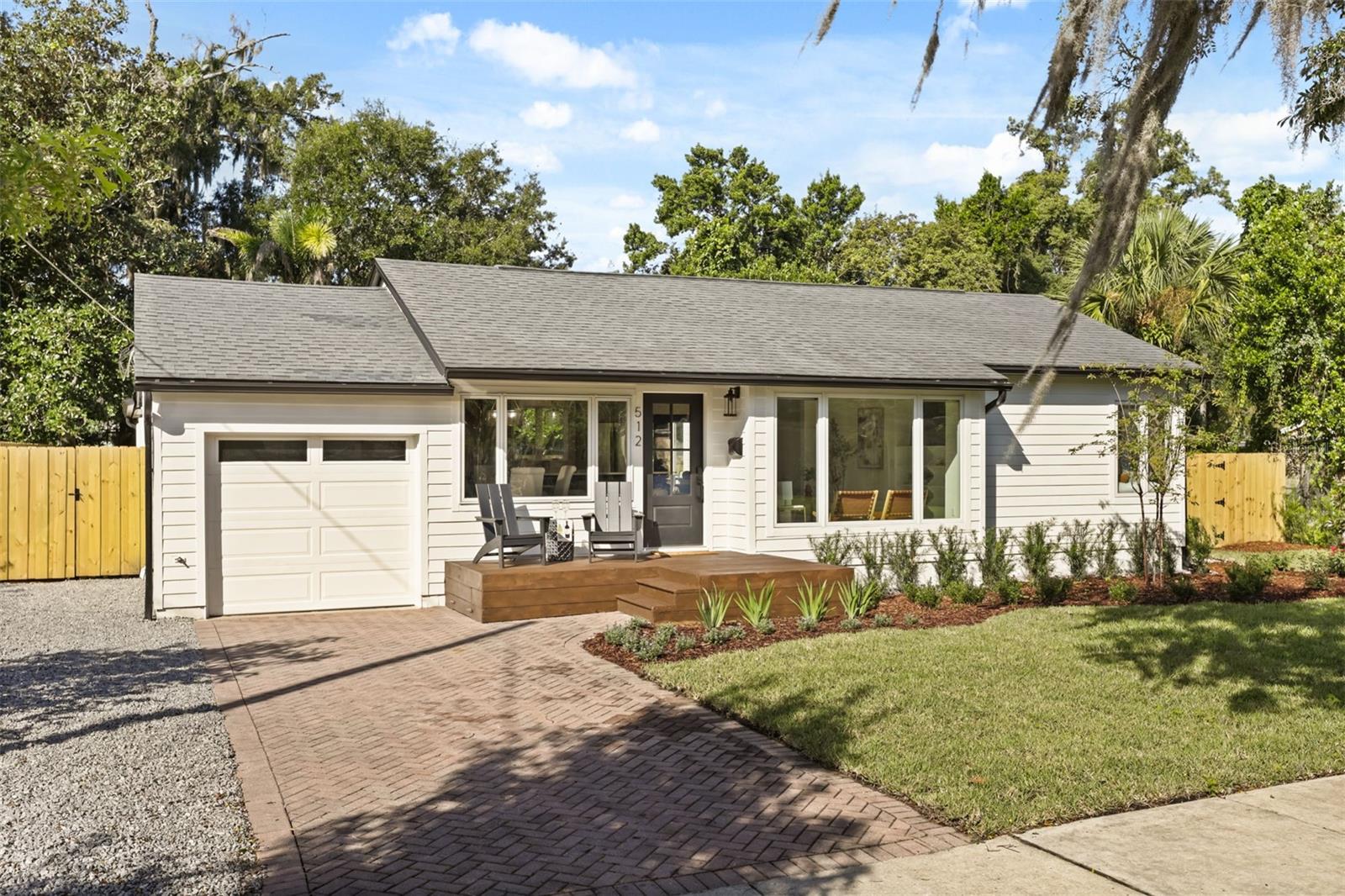 View of front facade with front porch and one car garage. - 512 MAYFAIR CIR, ORLANDO