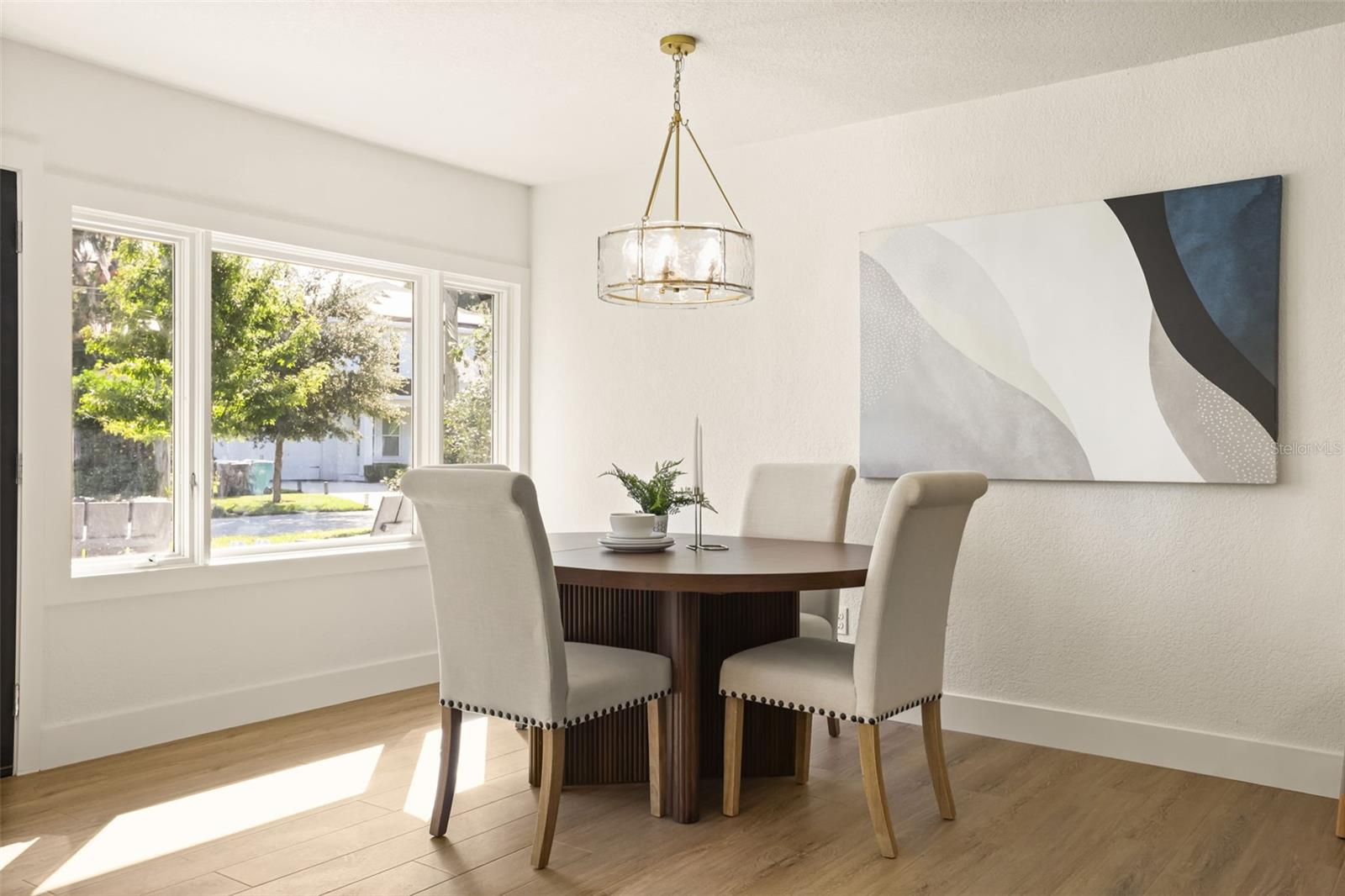 Dining room area with elegant lighting. - 512 MAYFAIR CIR, ORLANDO