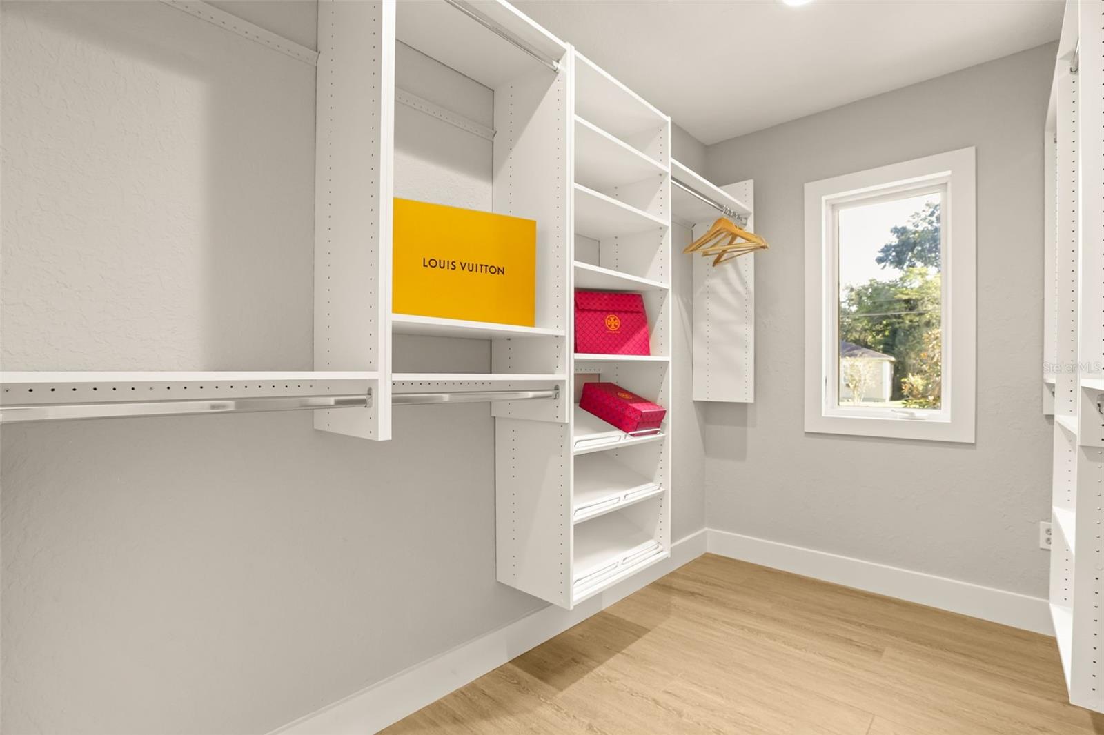 Primary bedroom custom walk-in closet. - 512 MAYFAIR CIR, ORLANDO