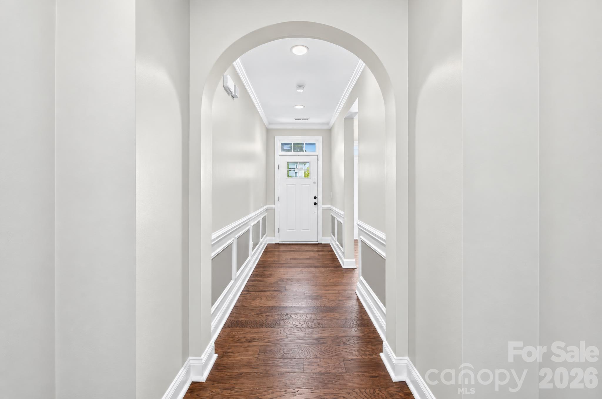 The instant you enter the front door, you are greeted by graceful, sweeping arch and stately molding accents. - 217 Blossom Ridge Drive, Mooresville