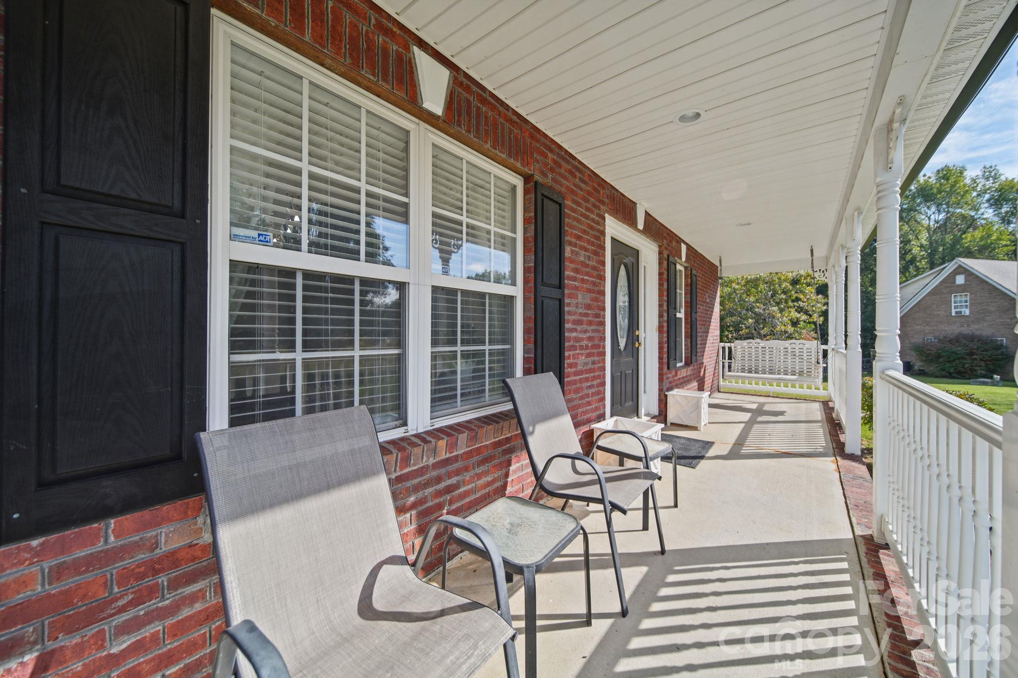 Generous covered front porch - 6717 Luther Lane, Monroe