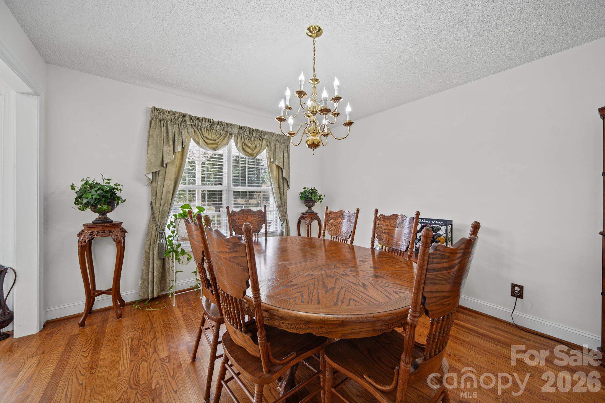 Dining room with hardwood floors - 6717 Luther Lane, Monroe