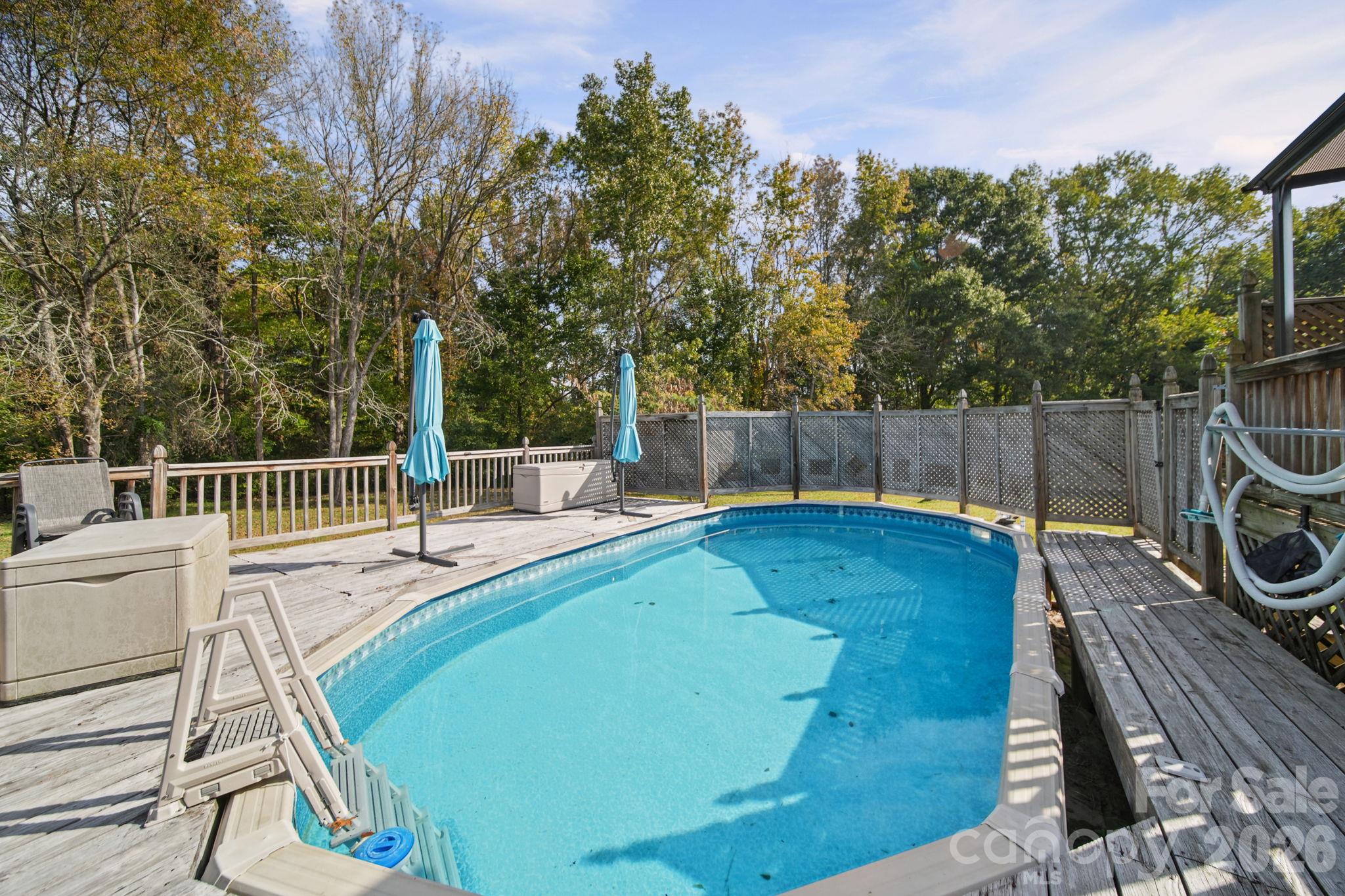 Above ground pool with surrounding deck - 6717 Luther Lane, Monroe