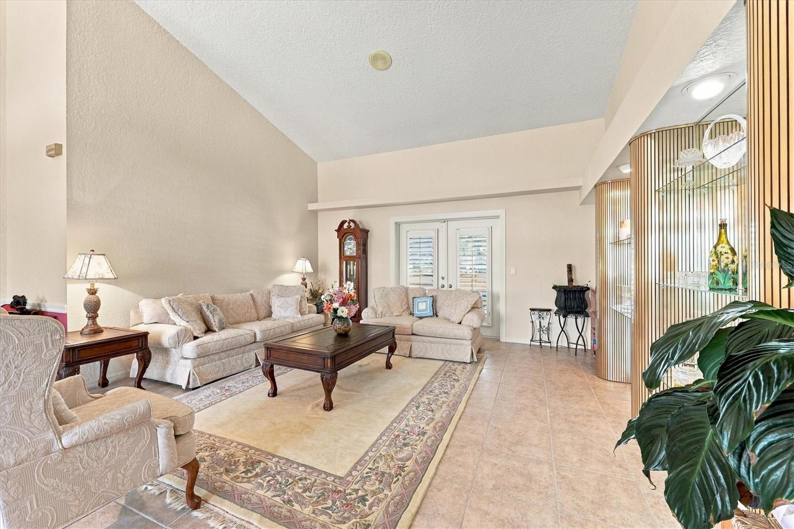 Expansive living room with access to pool area. - 175 NORMAN ST, PORT CHARLOTTE