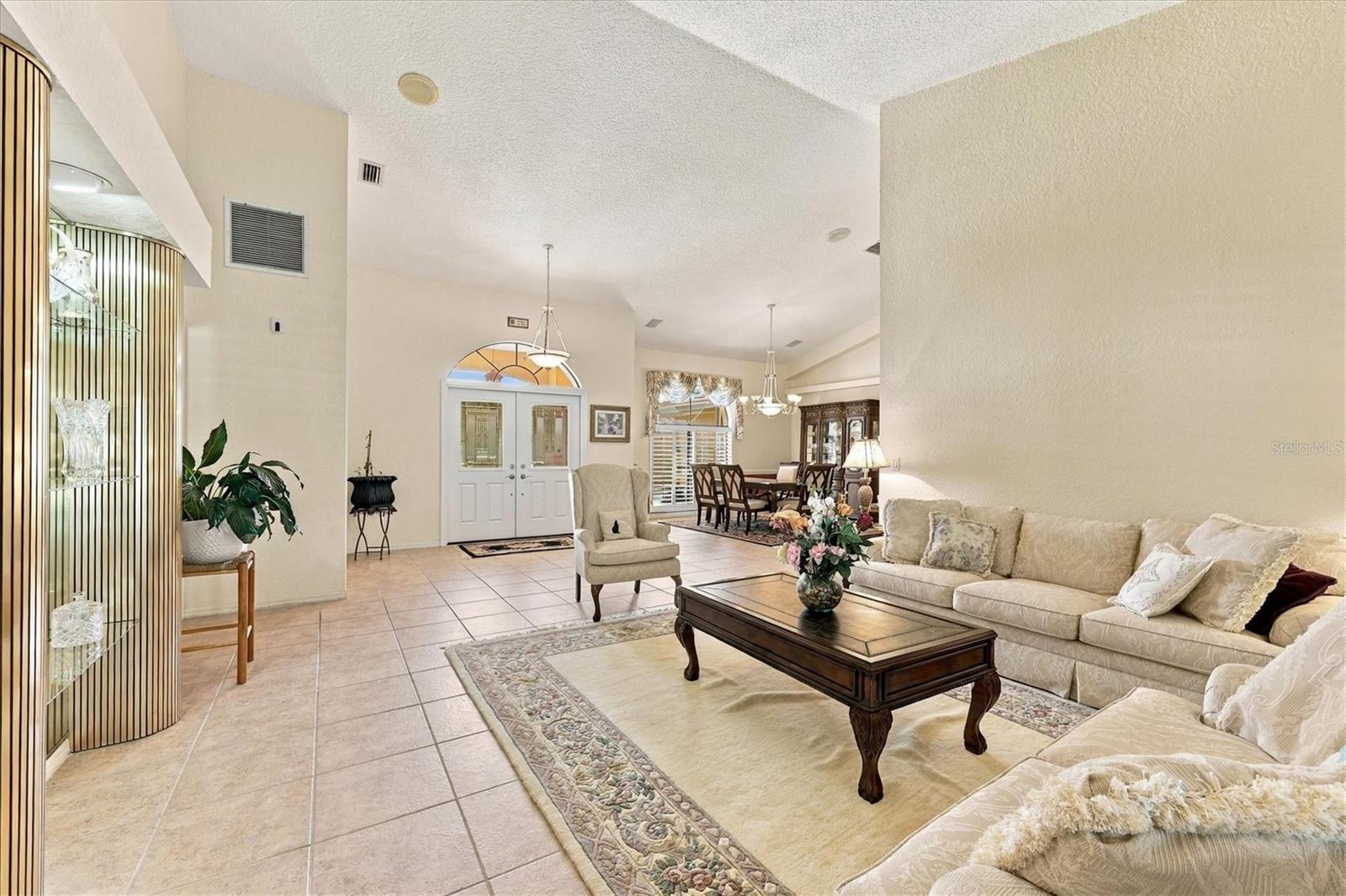 Living are with view to entry and dining area. - 175 NORMAN ST, PORT CHARLOTTE