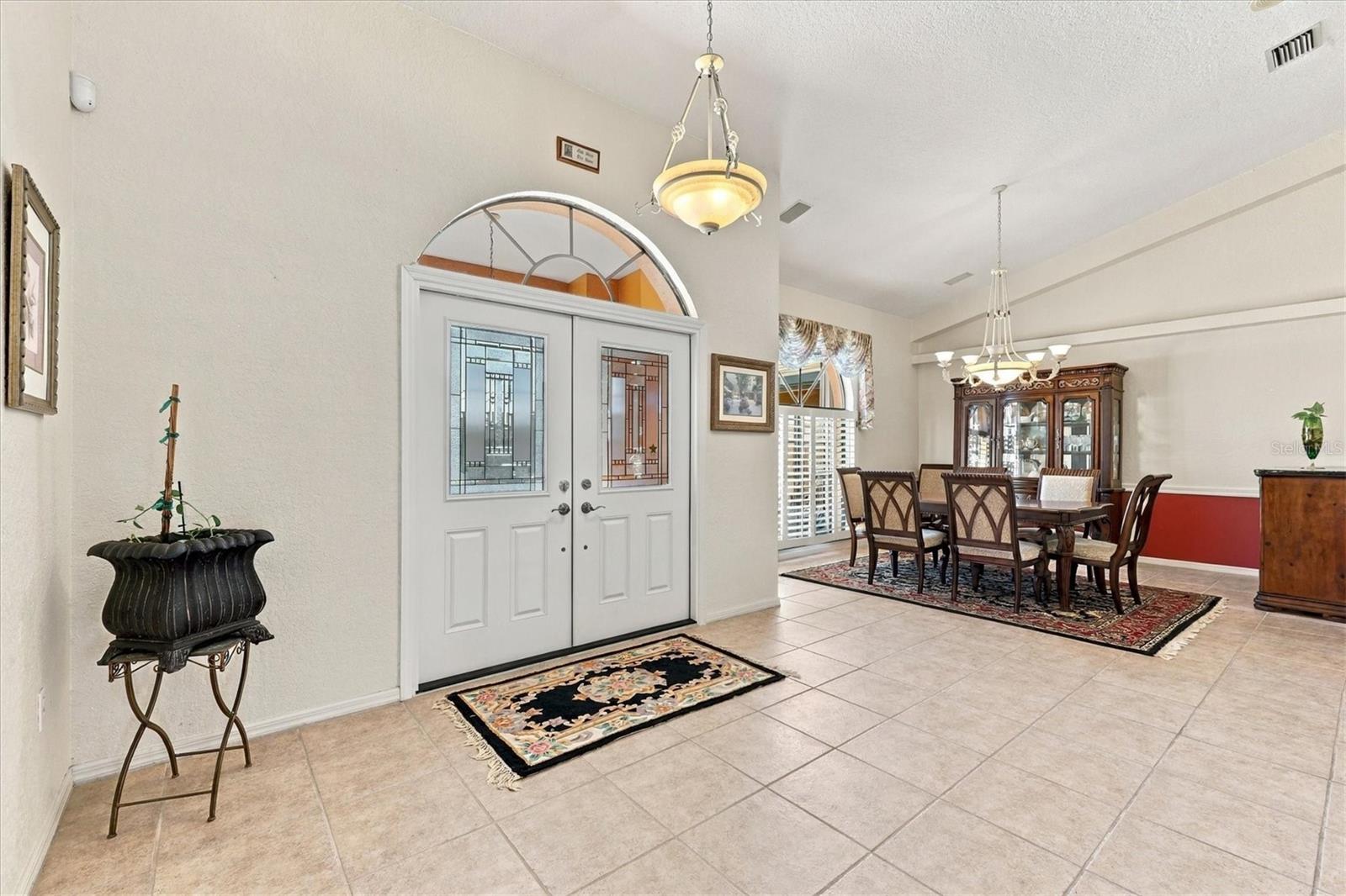 Double door entry with access to Living and Dining rooms. With views to the pool as you enter. - 175 NORMAN ST, PORT CHARLOTTE