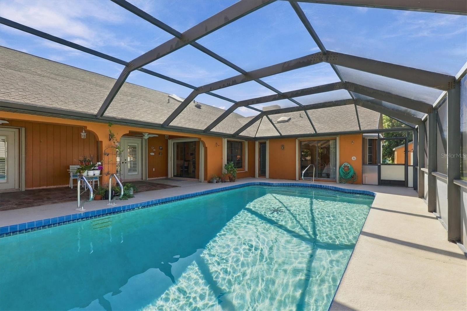 Pool waiting for you to cool off. Storm shutters on all openings. - 175 NORMAN ST, PORT CHARLOTTE