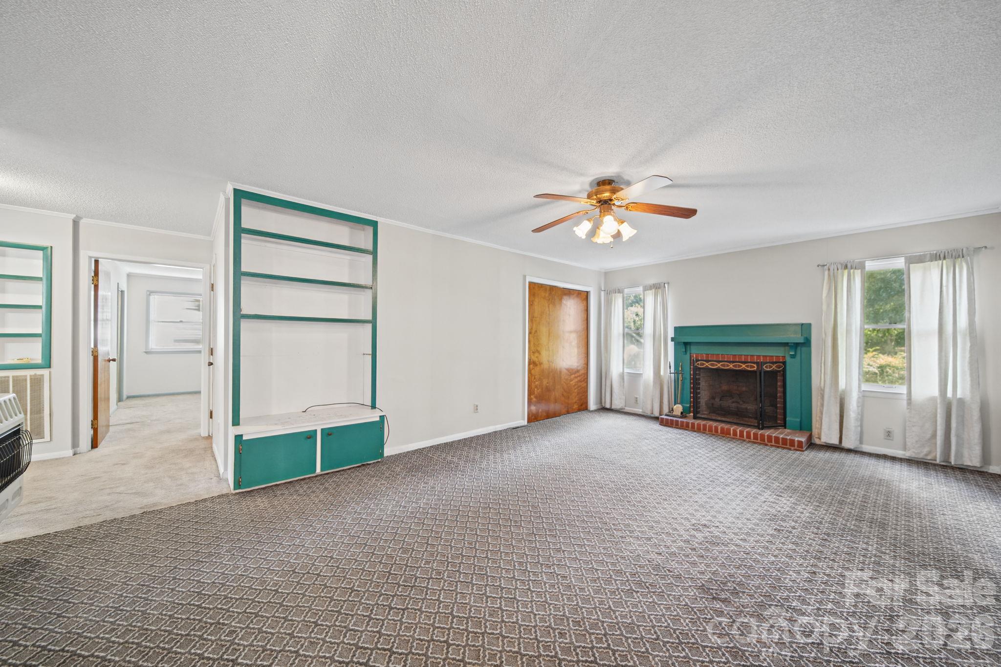 Family room off kitchen. Gas logs. as well as emergency propane heater. - 220 N Russell Street, Troy