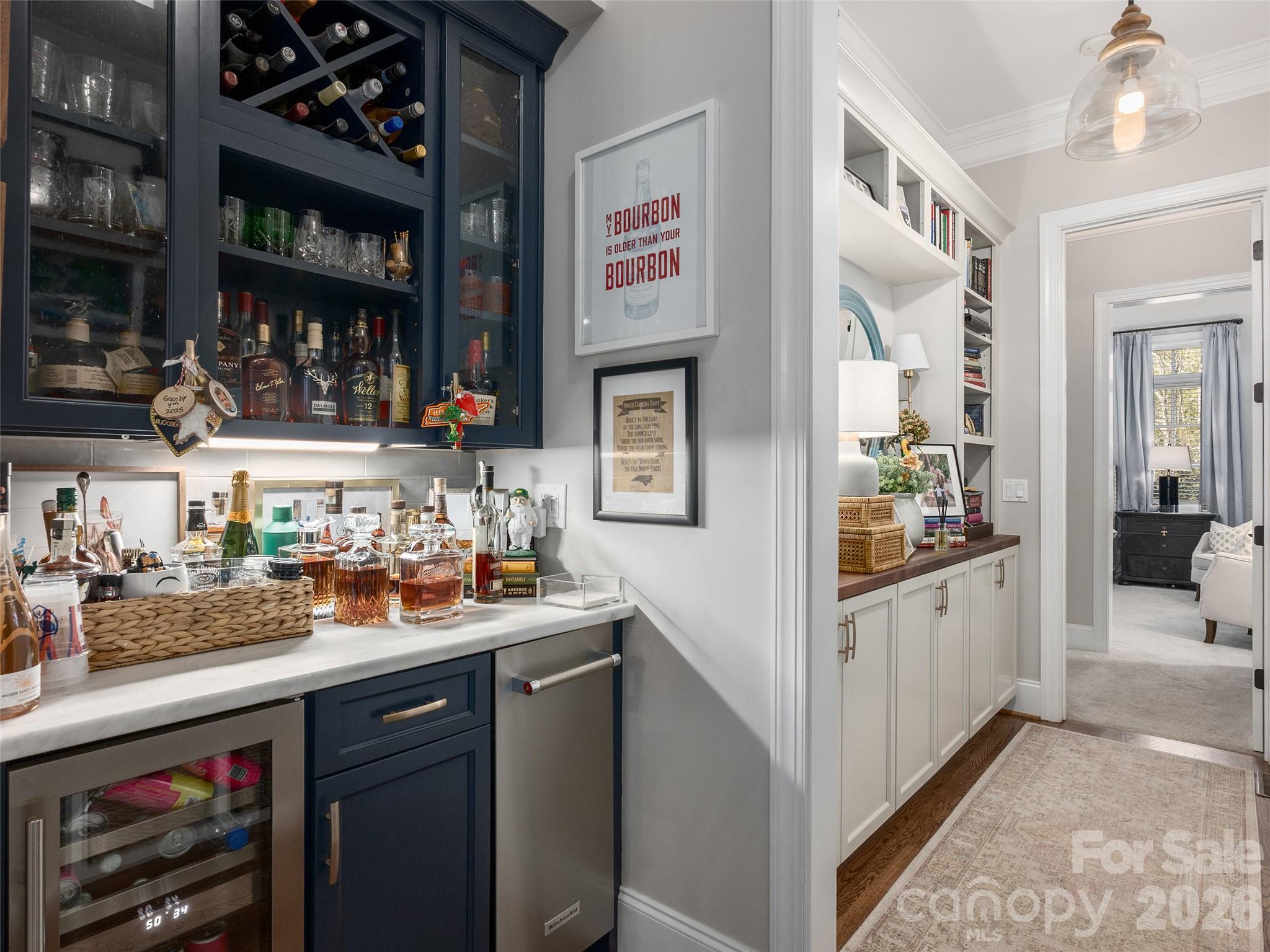 Hallway to Primary Suite with Bar, Beverage Refrigerator and Custom Shelving and Cabinets - 133 Lakeway Drive, Mills River