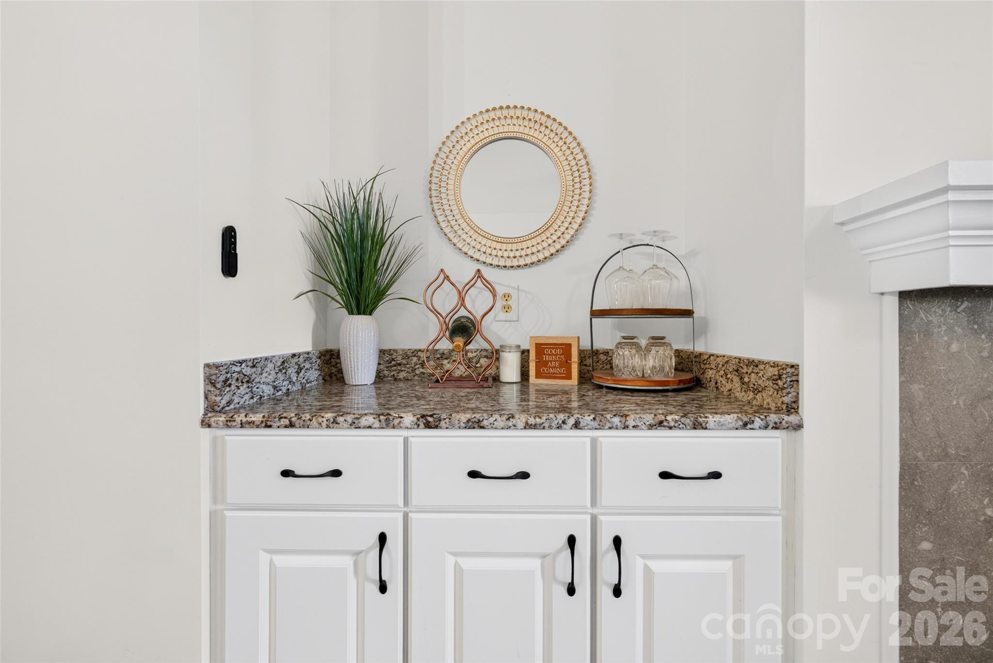 Built-ins with beautiful granite countertops offer the perfect space for a coffee or wine bar! - 928 Southwest Drive, Davidson