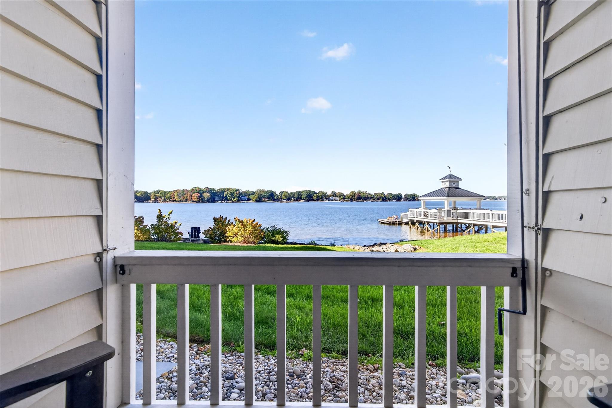 Ready to experience the LOW-MAINTENANCE Lake Norman lifestyle with BREATHTAKING views and spectacular sunsets? Opportunities like this don't come along often! Don't miss your chance to make this lakeside retreat your own! - 928 Southwest Drive, Davidson