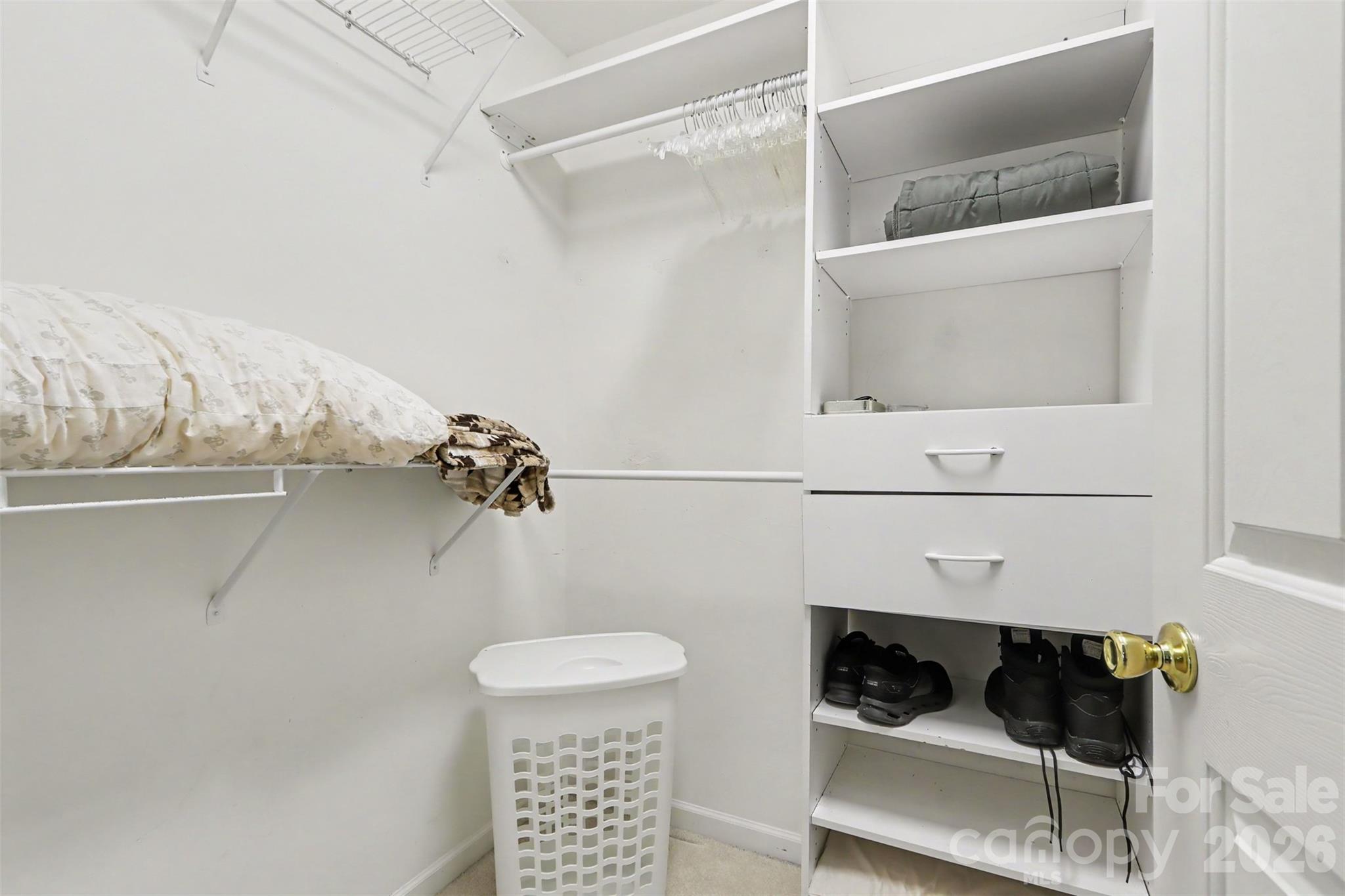 primary walk in closet - 6308 Creek Breeze Road, Charlotte