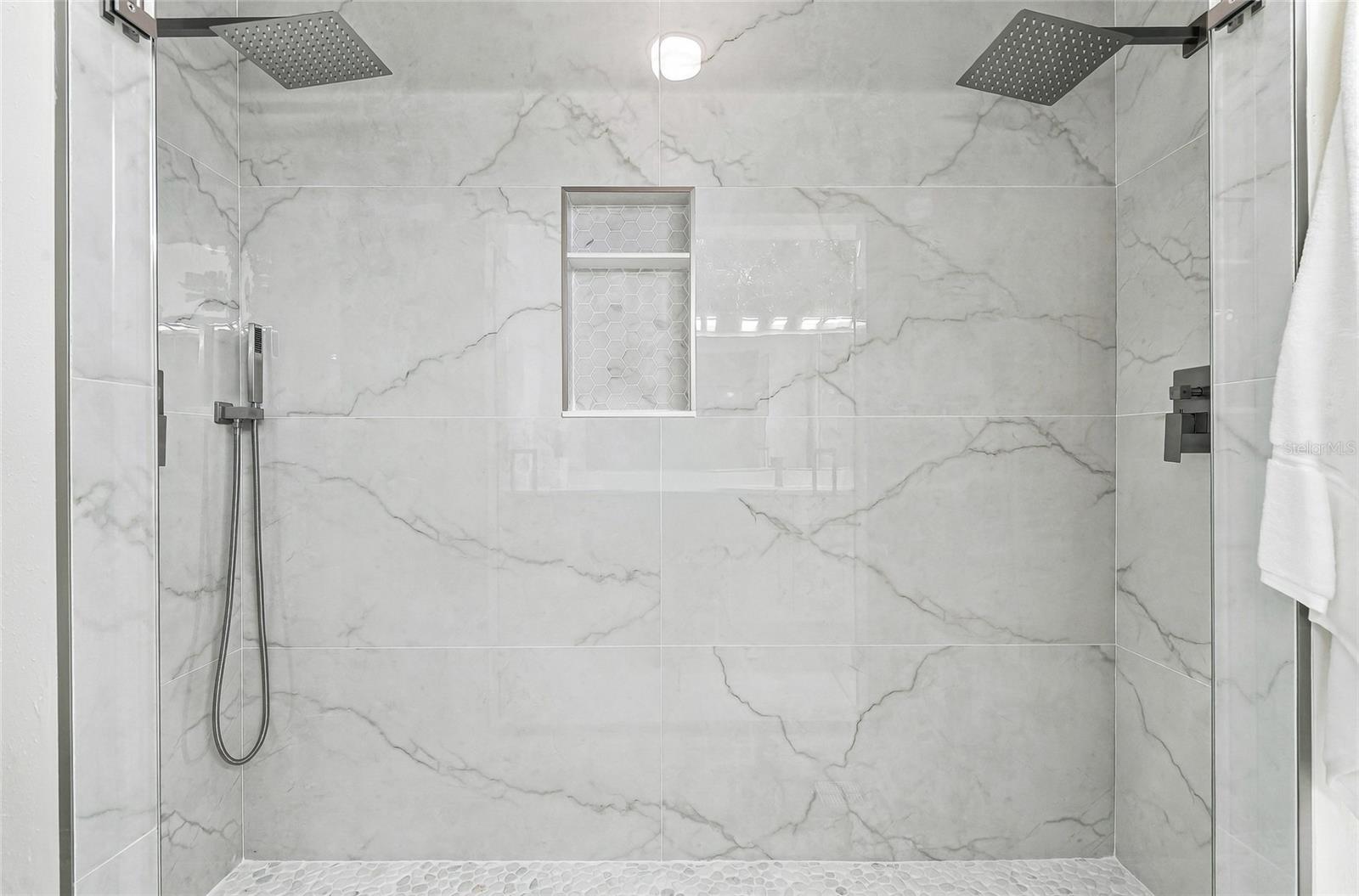 Dual rain shower heads in the primary bathroom. - 1101 DARLINGTON OAK DR NE, ST PETERSBURG