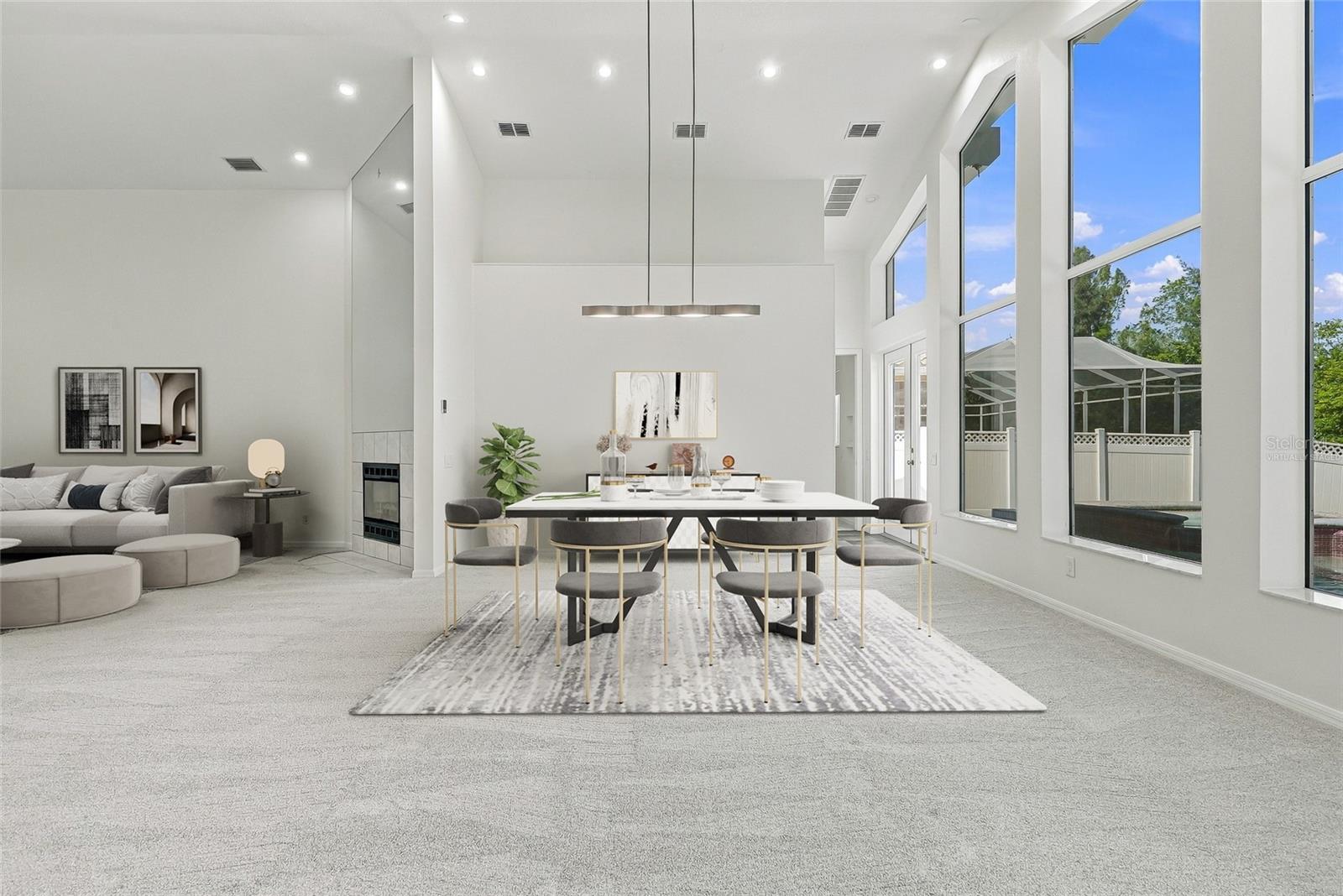 Imagine entertaining with views out these stunning windows overlooking the pool and natural preserve. Virtually staged. - 1101 DARLINGTON OAK DR NE, ST PETERSBURG