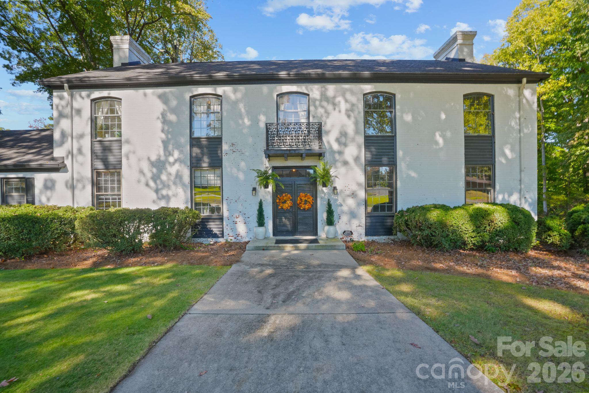 Front - Full Brick, French Provincial - tall Curved Top Windows, Flanking Fireplaces on either End, Iron Balcony - 319 N Zion Street, Landis