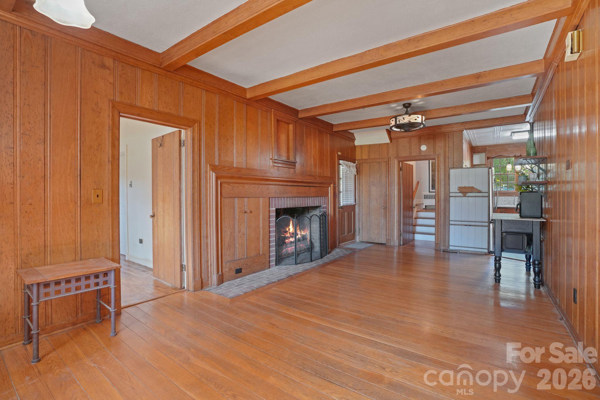 Unique Family Gathering Room at the Kitchen and back Staircase to Upstairs Bedrooms, Gas Fireplace, Wormy Chestnut Walls , Architectural Beams - 319 N Zion Street, Landis