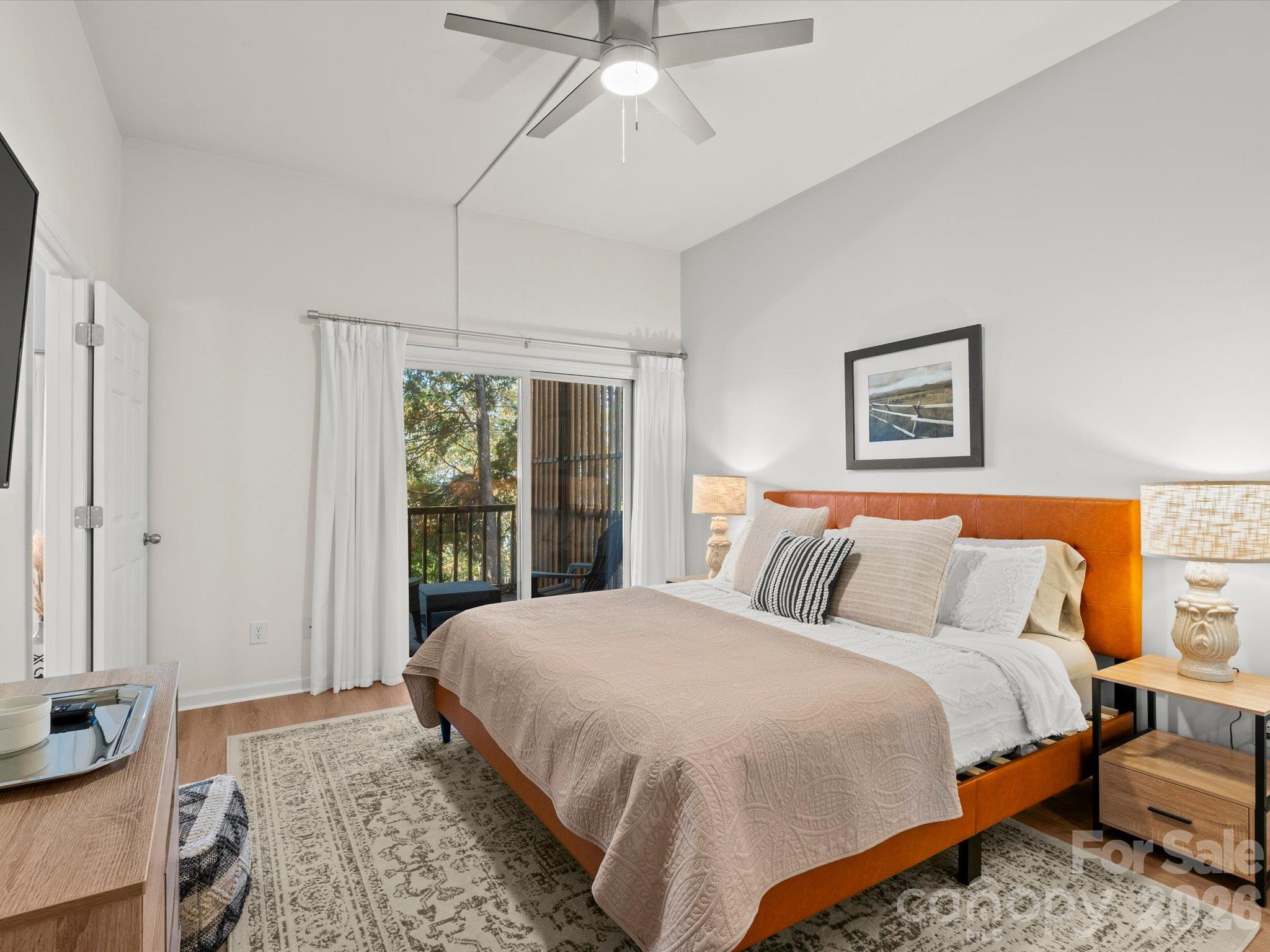 A sliding glass door also brings light and access to the balcony - 524 Windswept Drive, Asheville