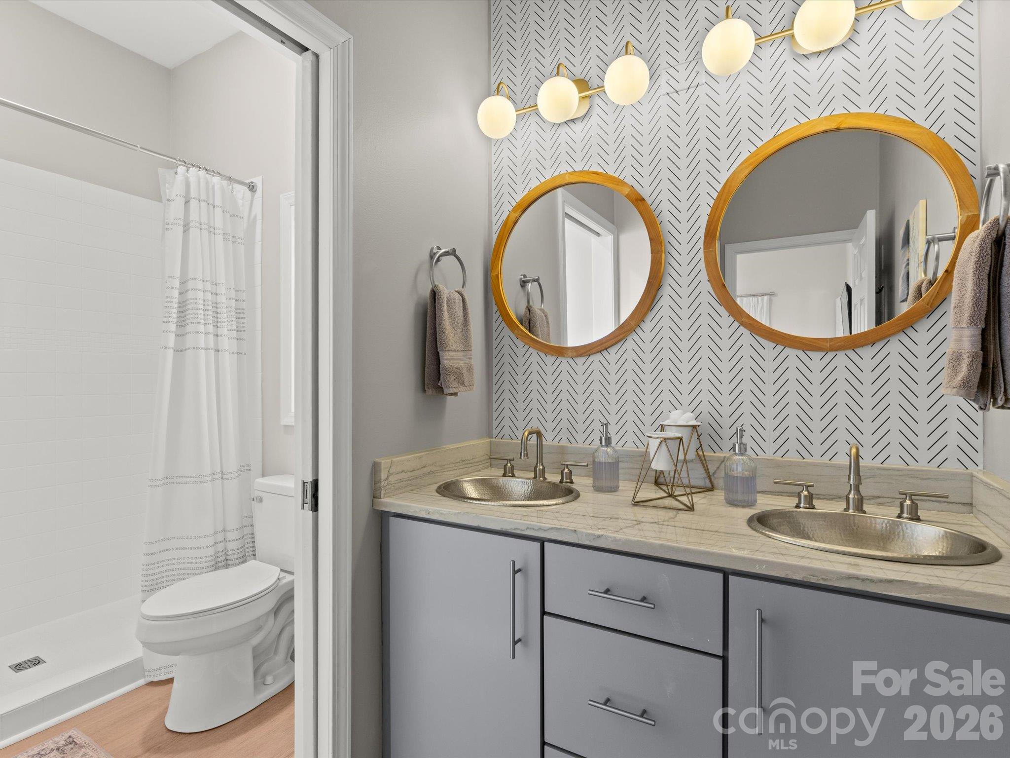 Granite countertops and modern cabinetry in the ensuite bathroom - 524 Windswept Drive, Asheville