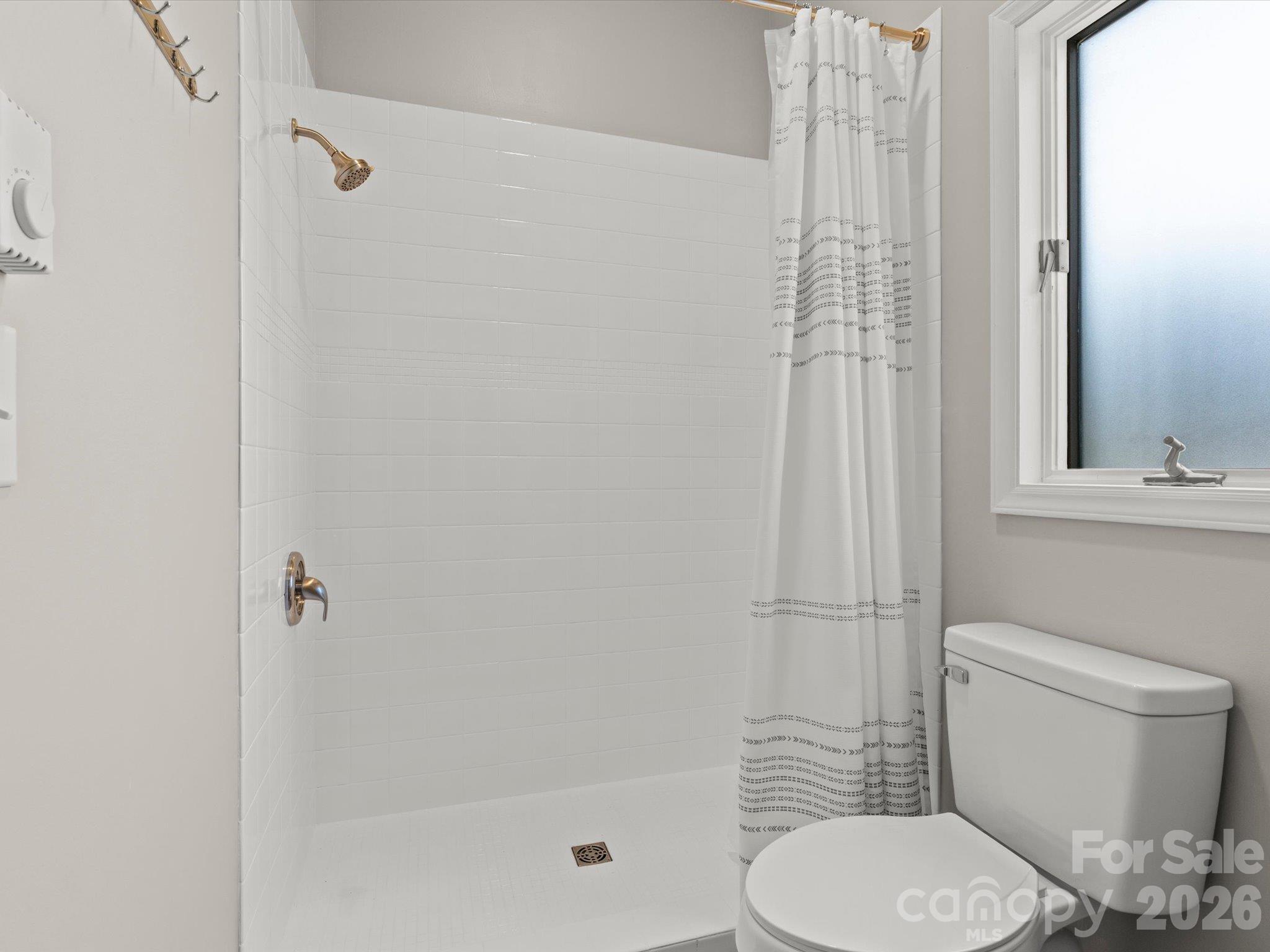 Walk-in tiled shower in the ensuite bathroom - 524 Windswept Drive, Asheville