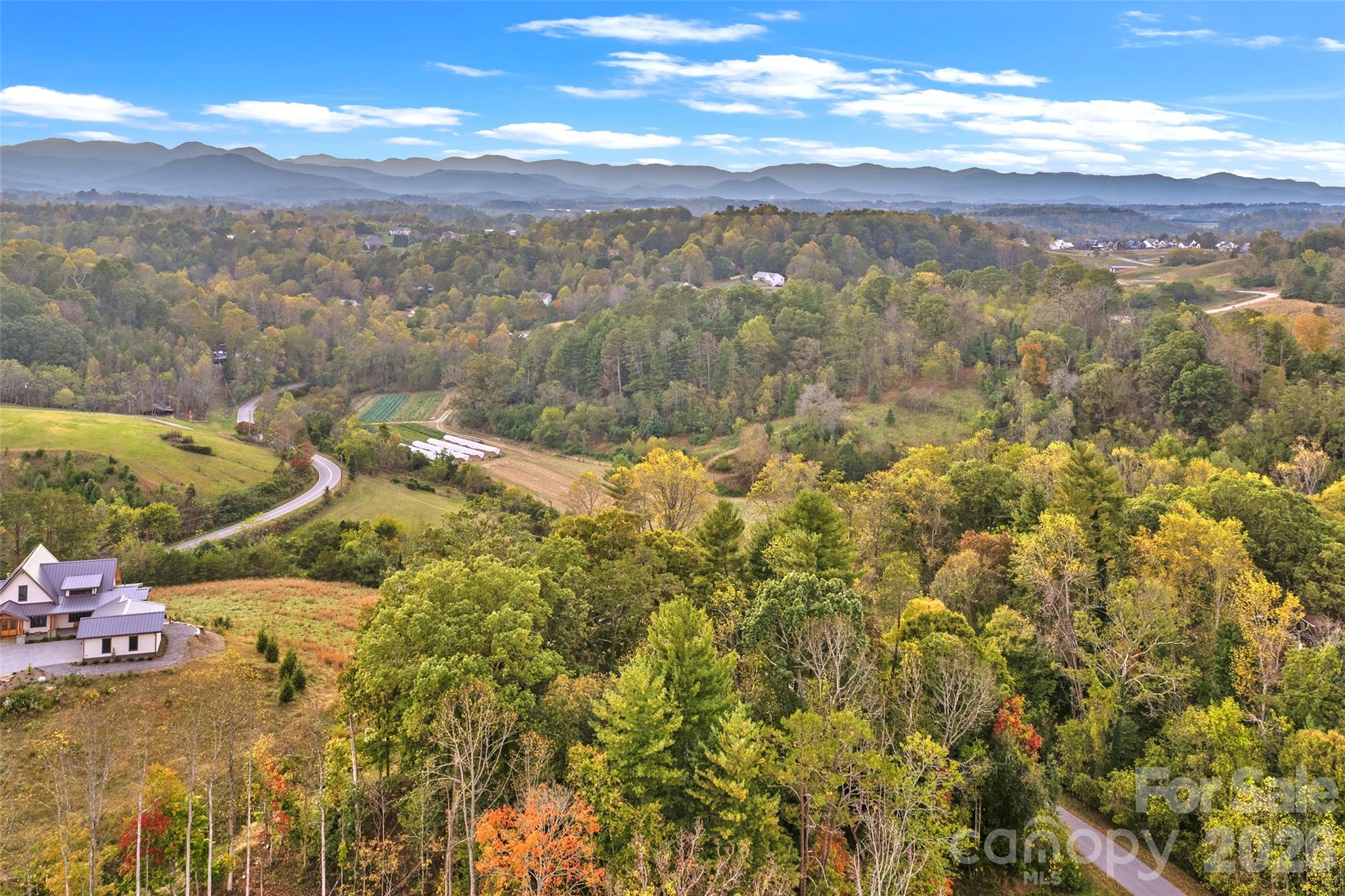 Aerial showcasing the views and setting of the lot - 17 French Broad River Way, Asheville