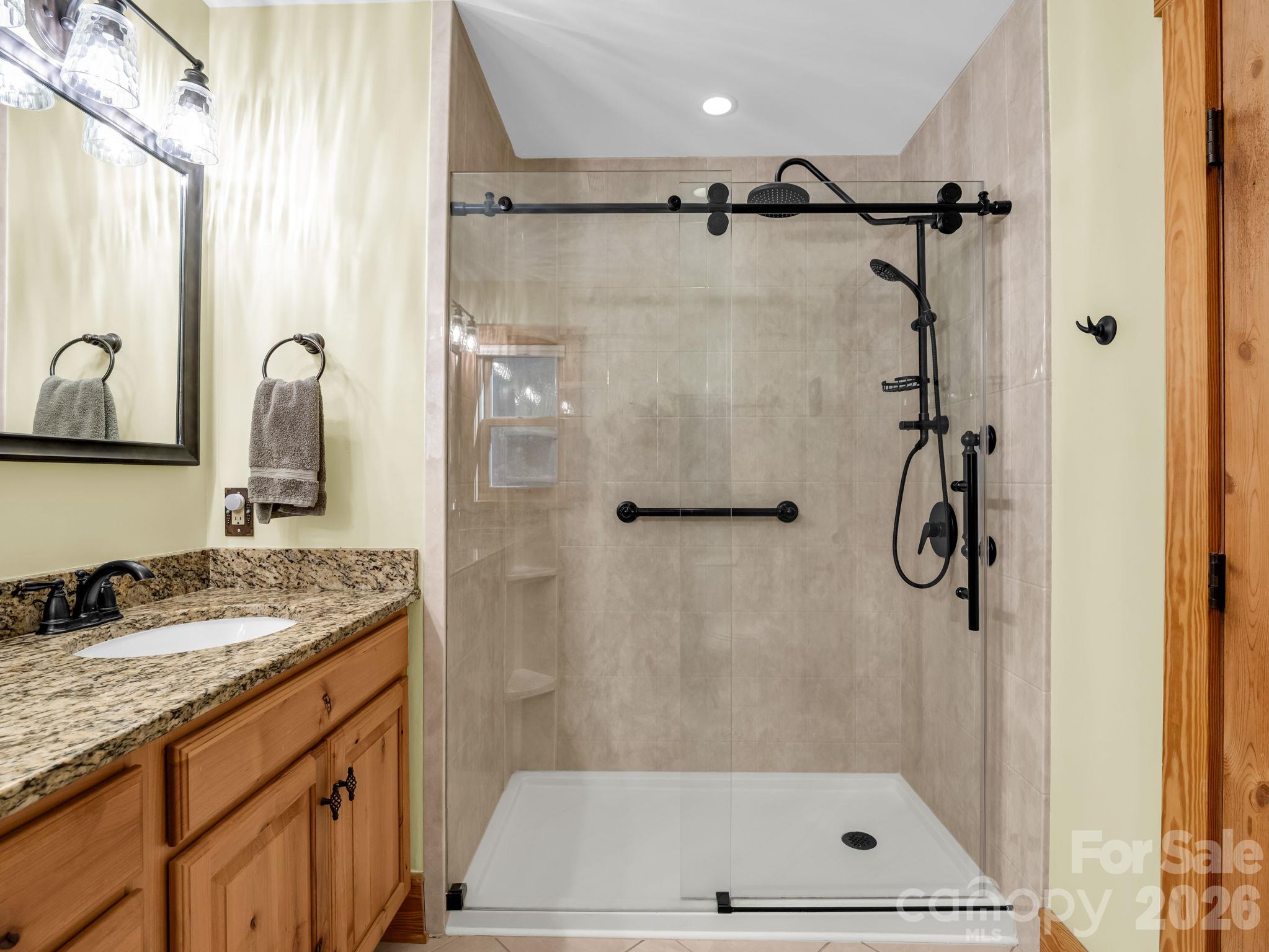 All three bathrooms undated. - 17 Caroline Road, Pisgah Forest
