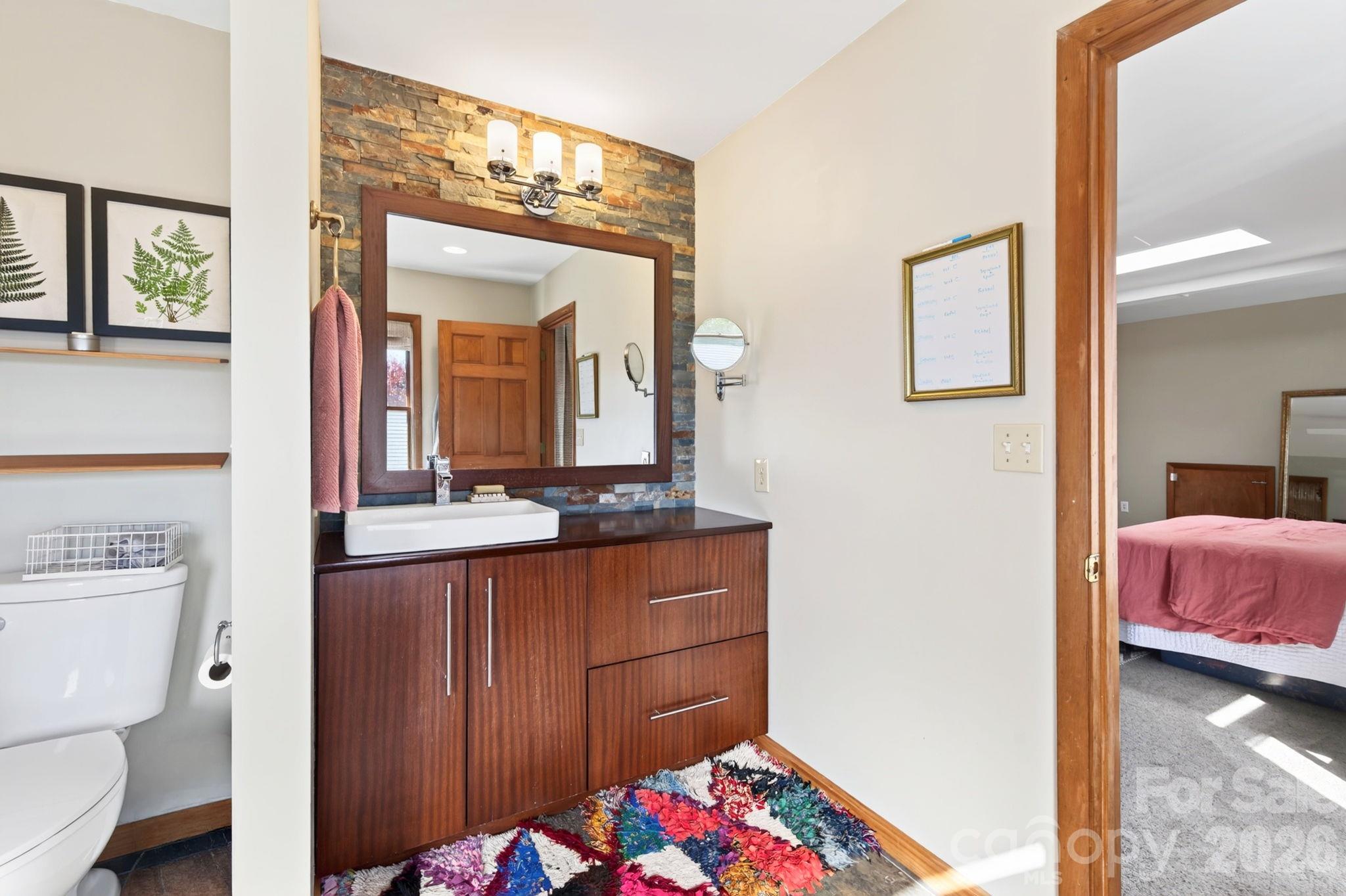Vanity with Stone Backsplash - 414 Old Haw Creek Road, Asheville