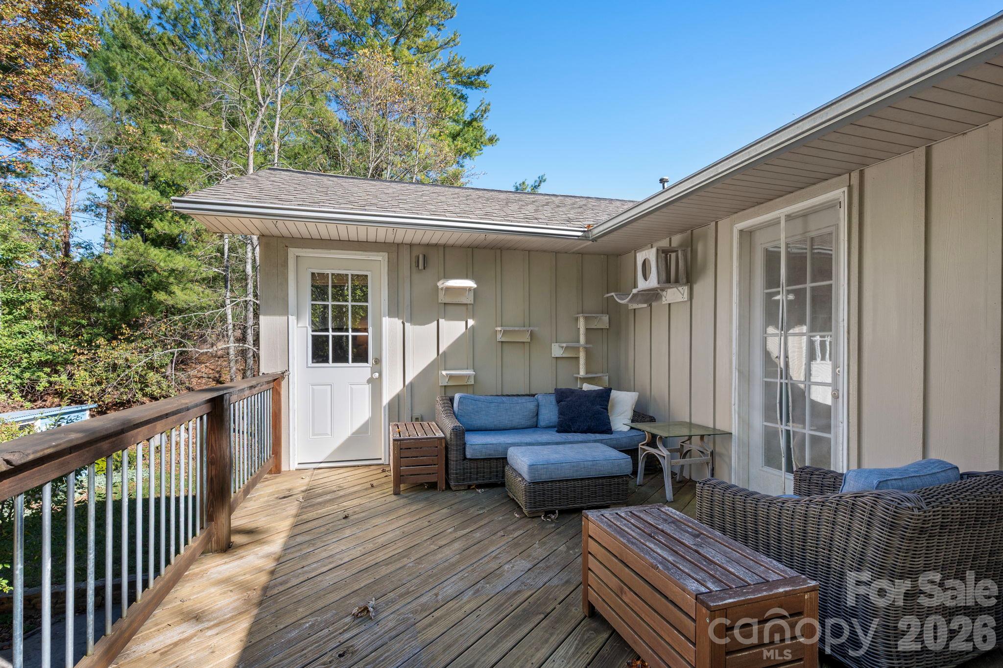Enjoy the Sounds of the Babbling Koi Pond from the Upper Deck - 414 Old Haw Creek Road, Asheville