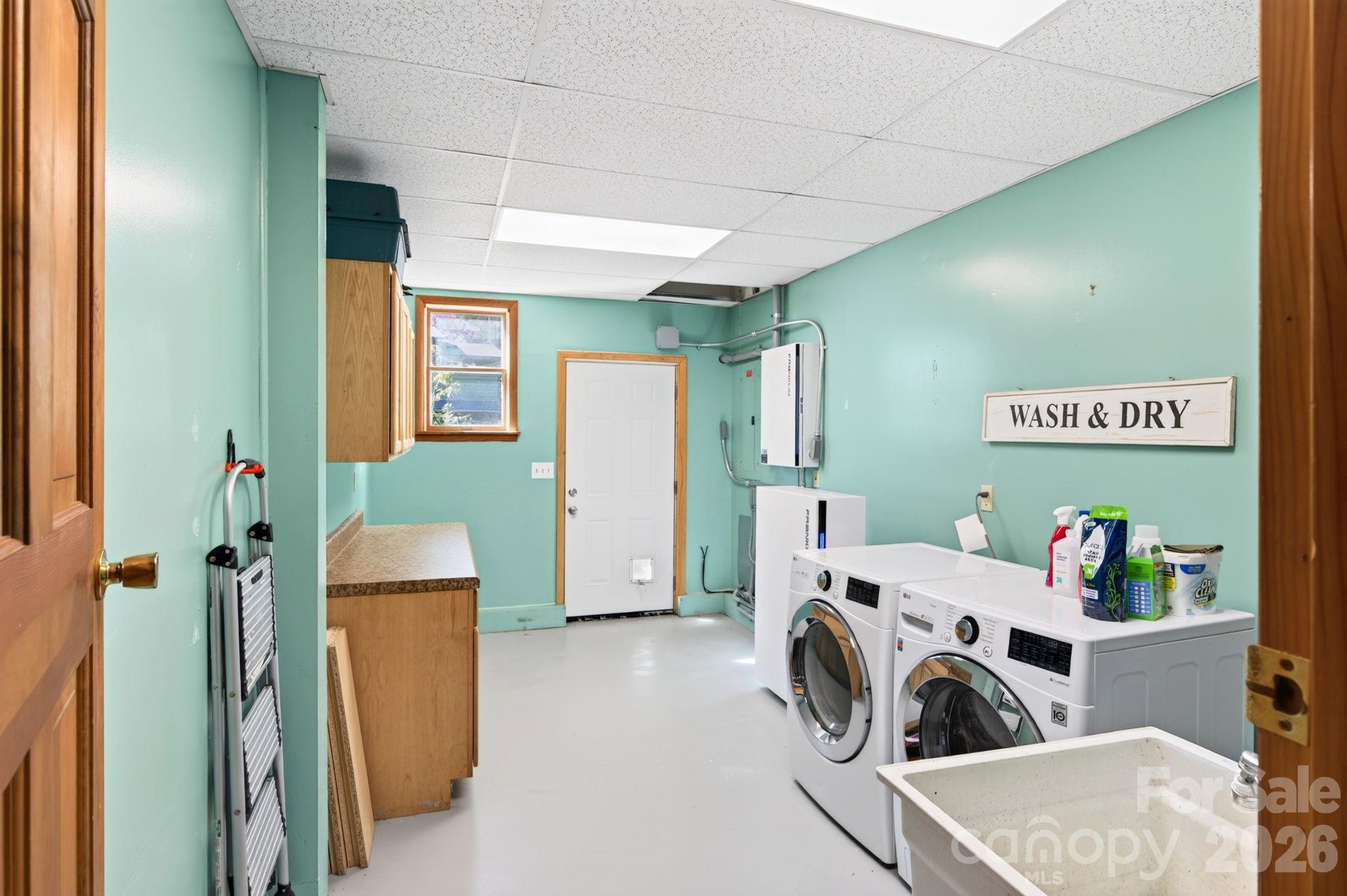 Convenient Laundry/ Mudroom on Main with Door to Driveway - 414 Old Haw Creek Road, Asheville