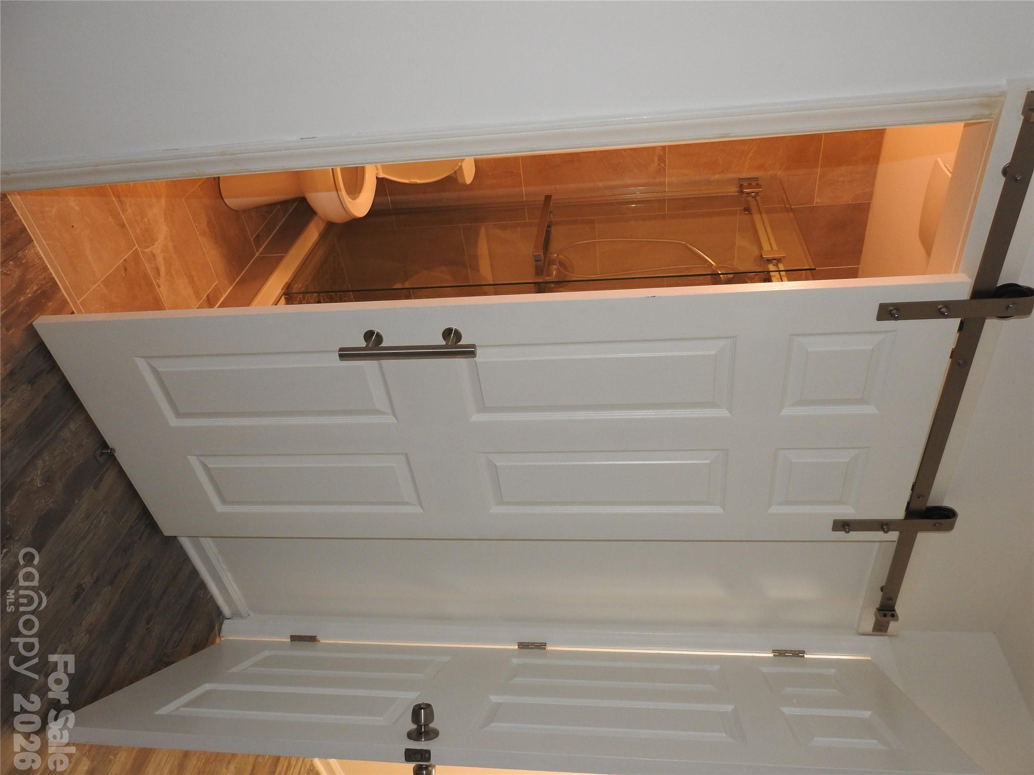 Space saving barn bathroom door. - 2913 Iron Gate Lane, Charlotte