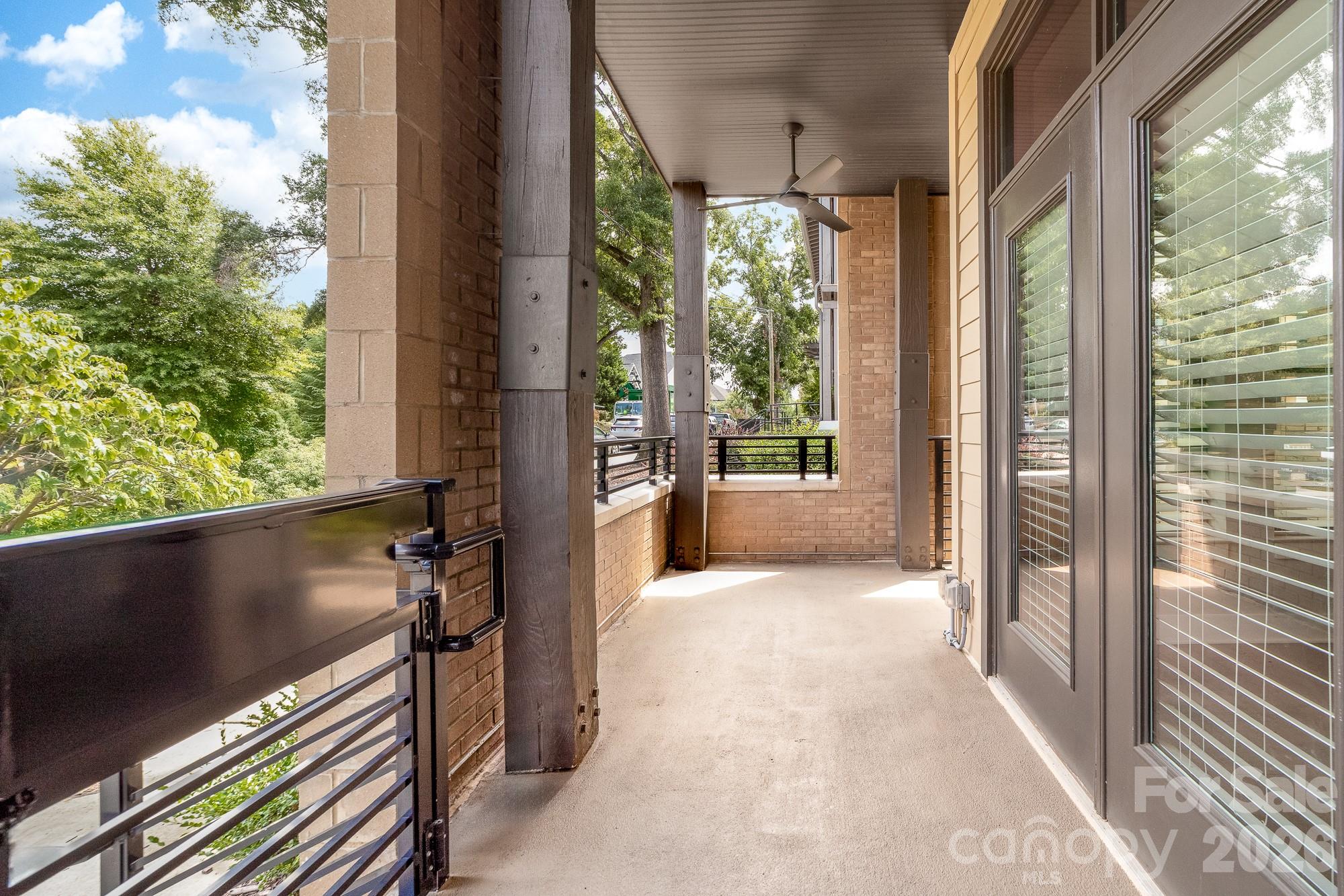 End unit condo means a larger covered porch area. - 2401 Euclid Avenue, Charlotte