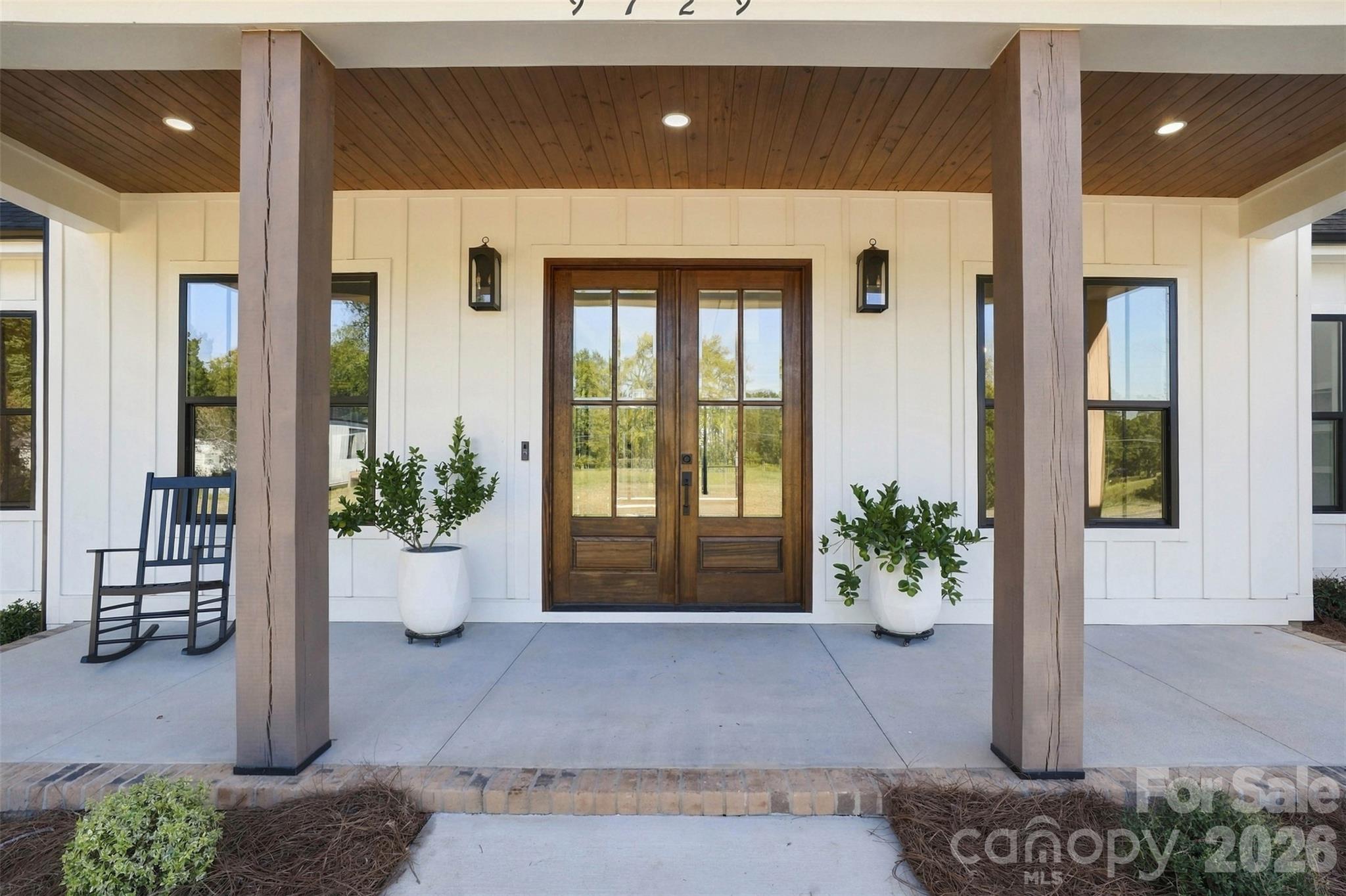 Covered front porch with optional wood accent ceiling - 509 Simpson Road, Locust