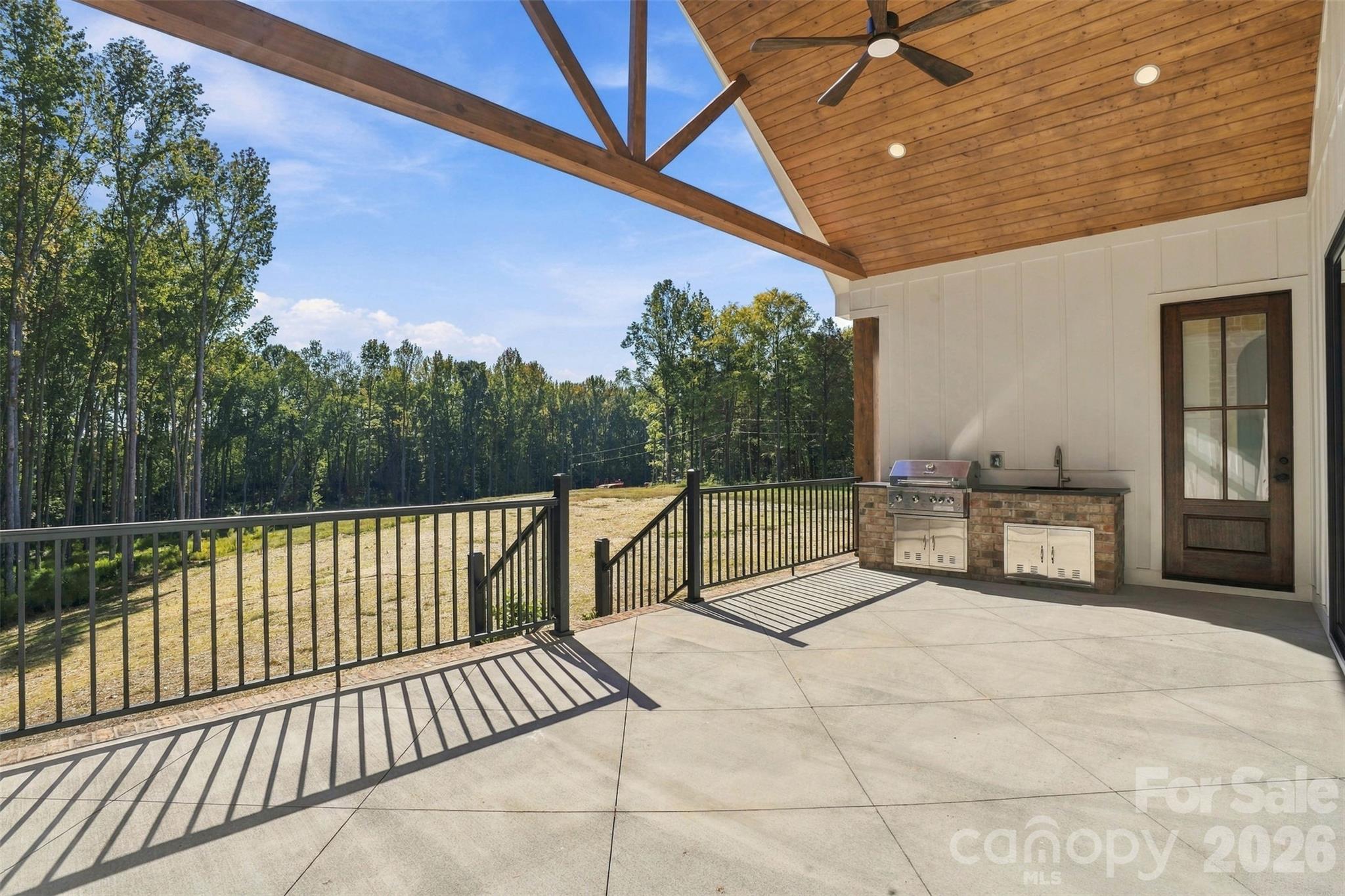 Covered back deck with optional porch, wood ceiling, and decorative truss - 509 Simpson Road, Locust