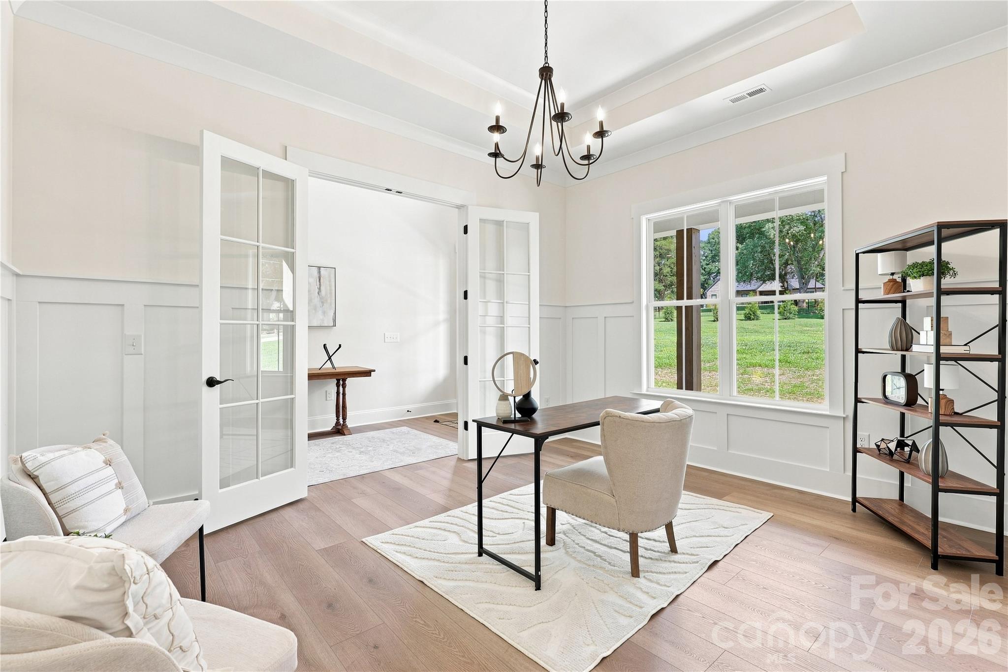Front office with included French doors, tray ceiling, accent woodwork on wall - 509 Simpson Road, Locust