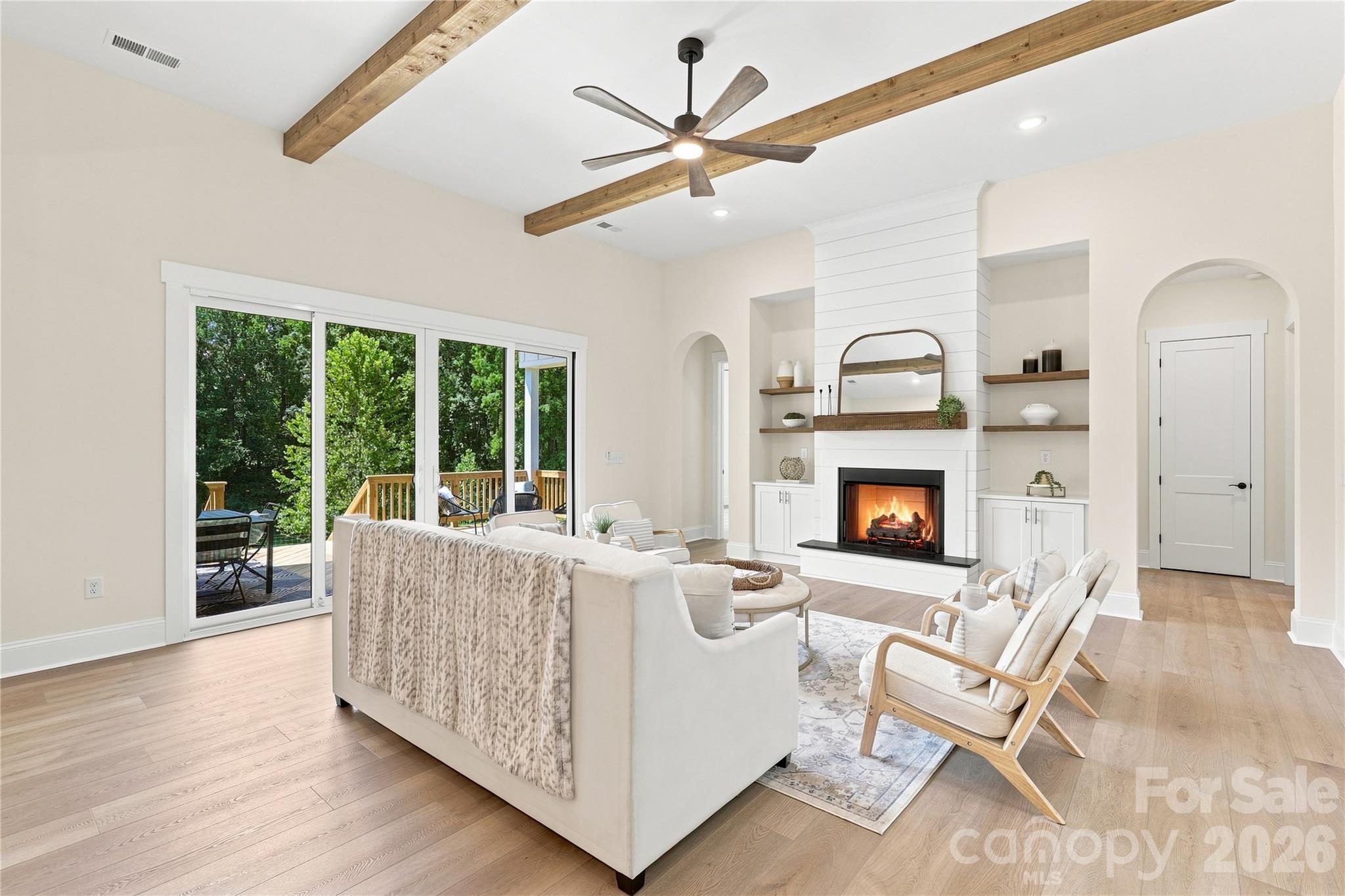 12' ceilings with stained beams,, arched doorways, fireplace & built-ins (Shown with included features) - 509 Simpson Road, Locust