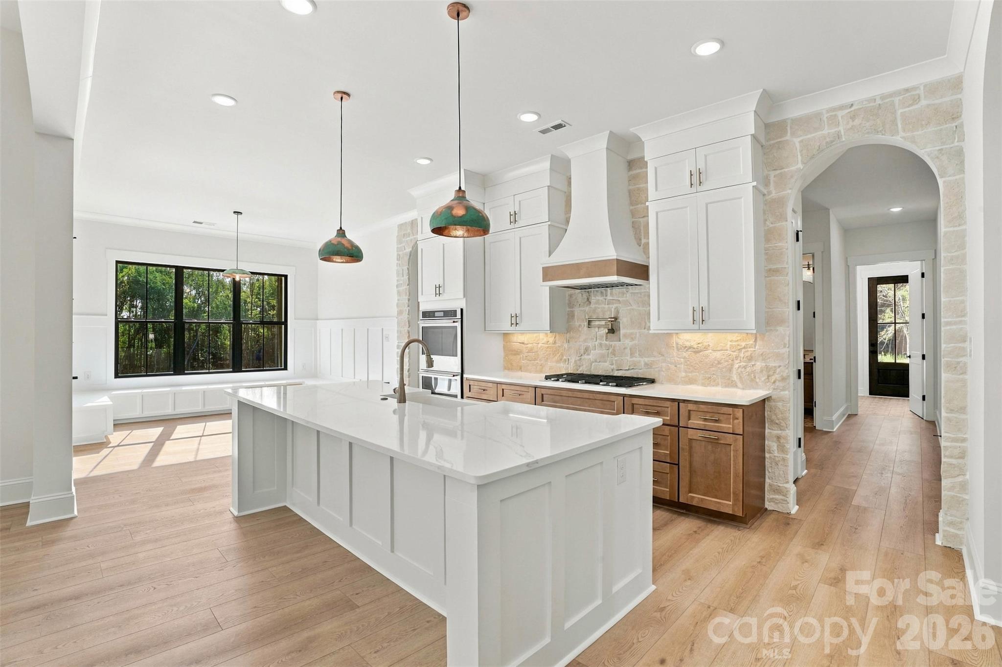 Kitchen shown with optional stonework and interior black windows - 509 Simpson Road, Locust