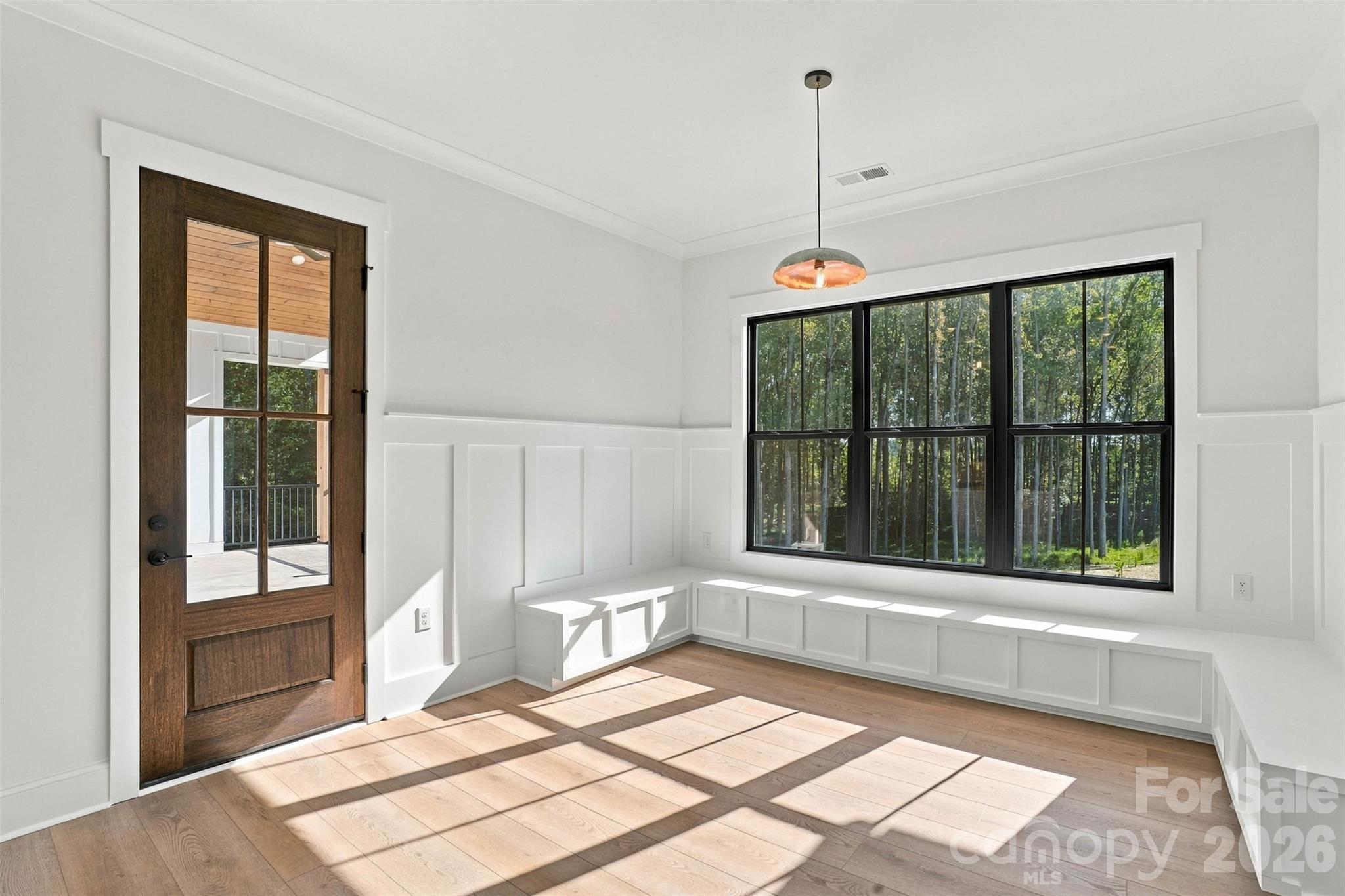 Eat-in kitchen with upgraded bench seating and black interior windows - 509 Simpson Road, Locust