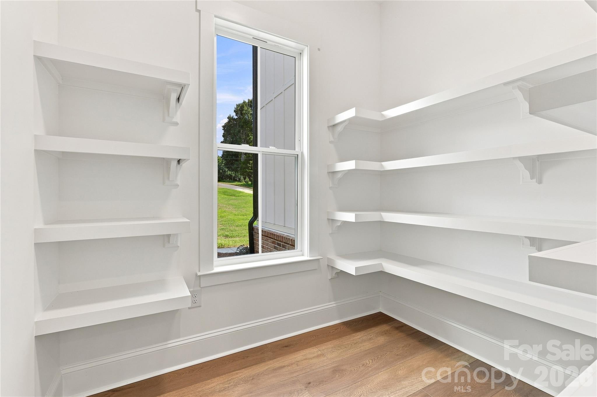 Walk-in pantry at off kitchen - looks out front window (shown as included feature) - 509 Simpson Road, Locust