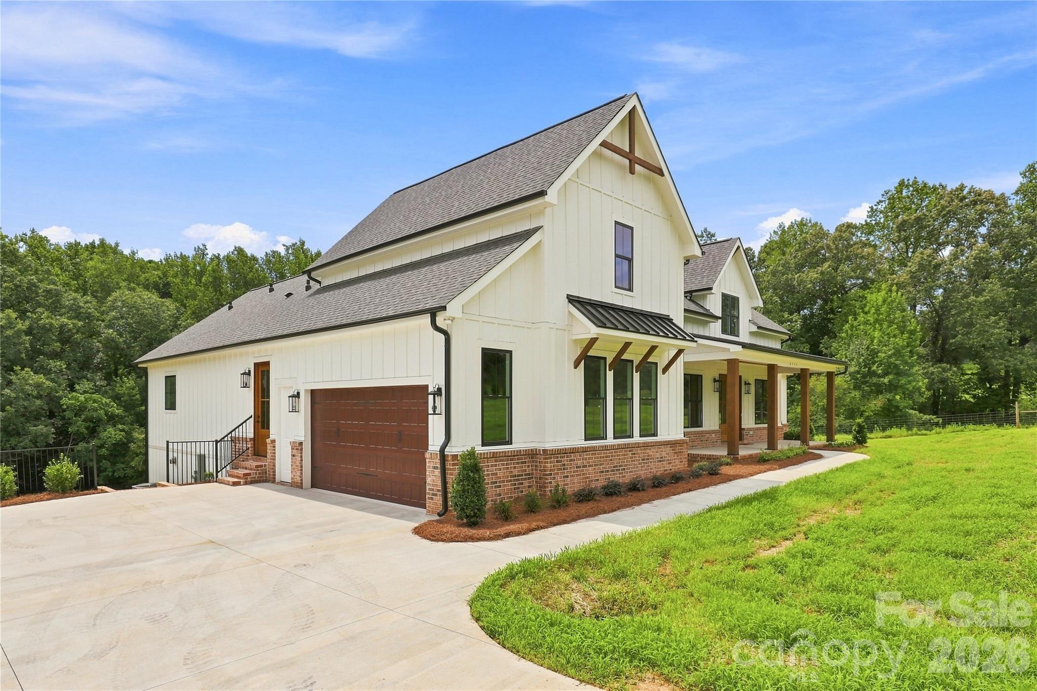 Side-load garage and upgraded door included; 30' x 30' concete parking pad included - 509 Simpson Road, Locust