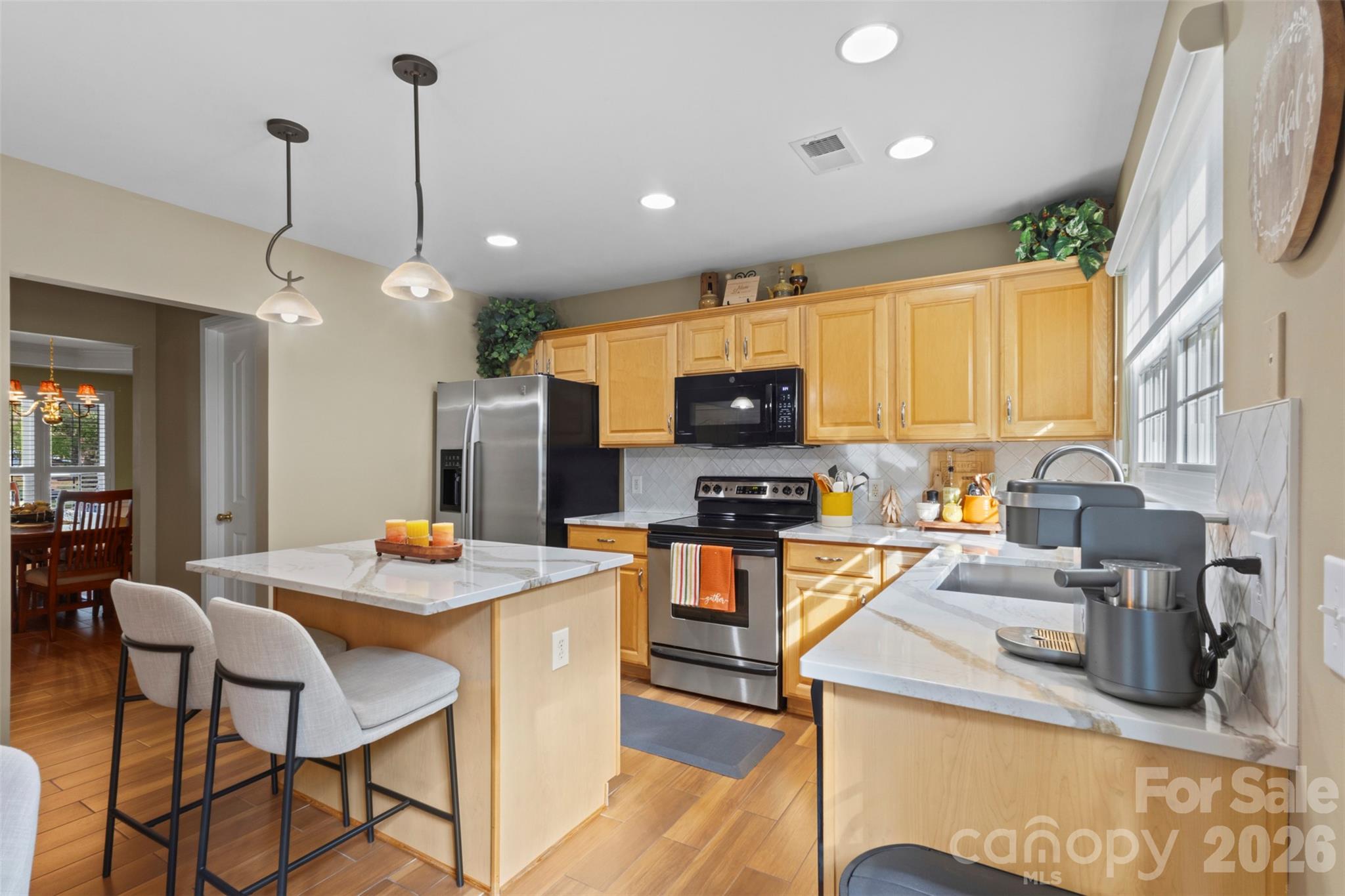 Kitchen directly accessible through hallway connecting to the dining room and powder room - 18912 Harbor Cove Drive, Cornelius