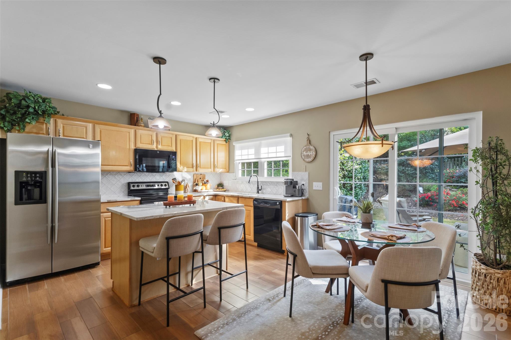 Open concept kitchen with breakfast area - 18912 Harbor Cove Drive, Cornelius