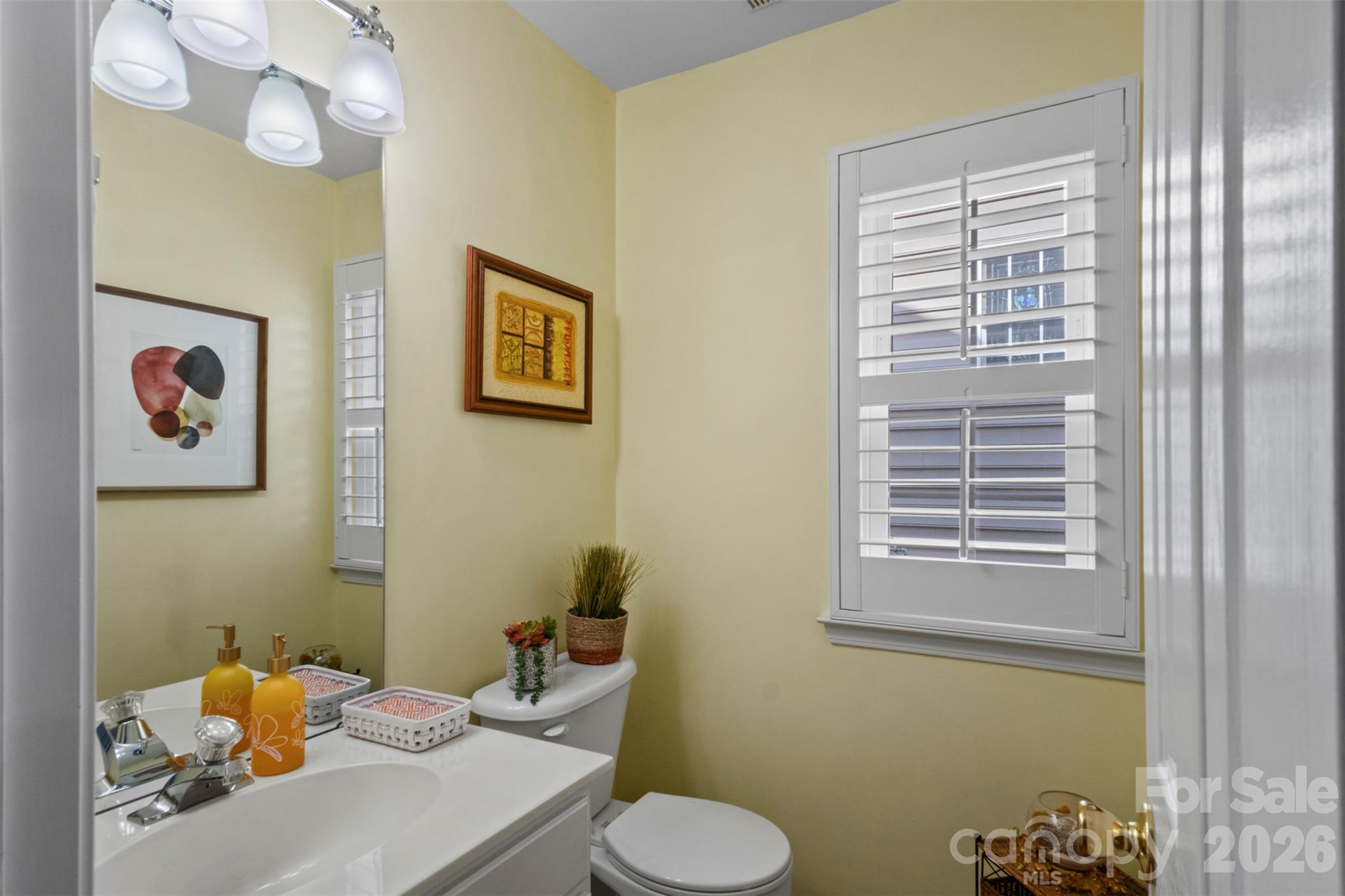 Downstairs powder room situated between the dining room and kitchen - 18912 Harbor Cove Drive, Cornelius